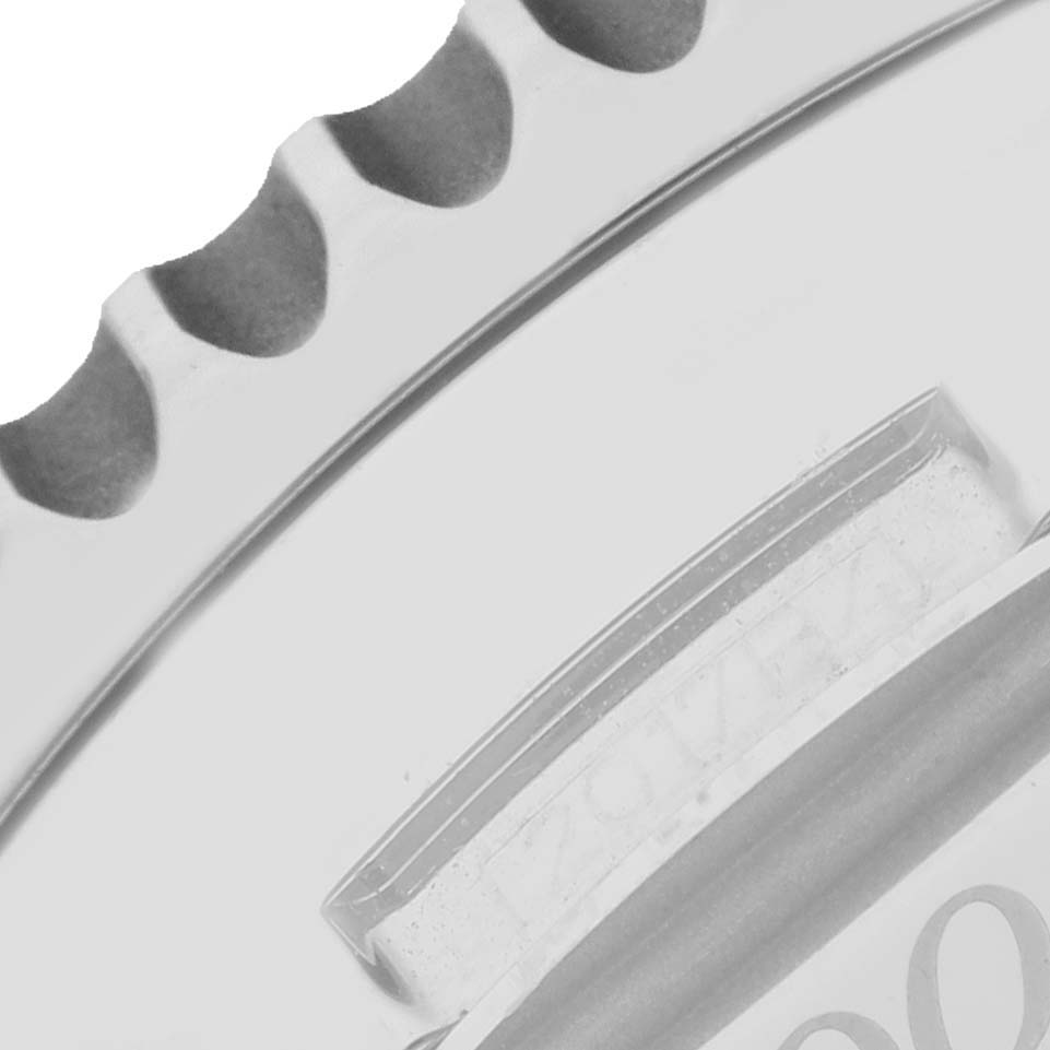 The image shows a close-up angle of the bezel and part of the dial of a Breitling Limited Series model watch.