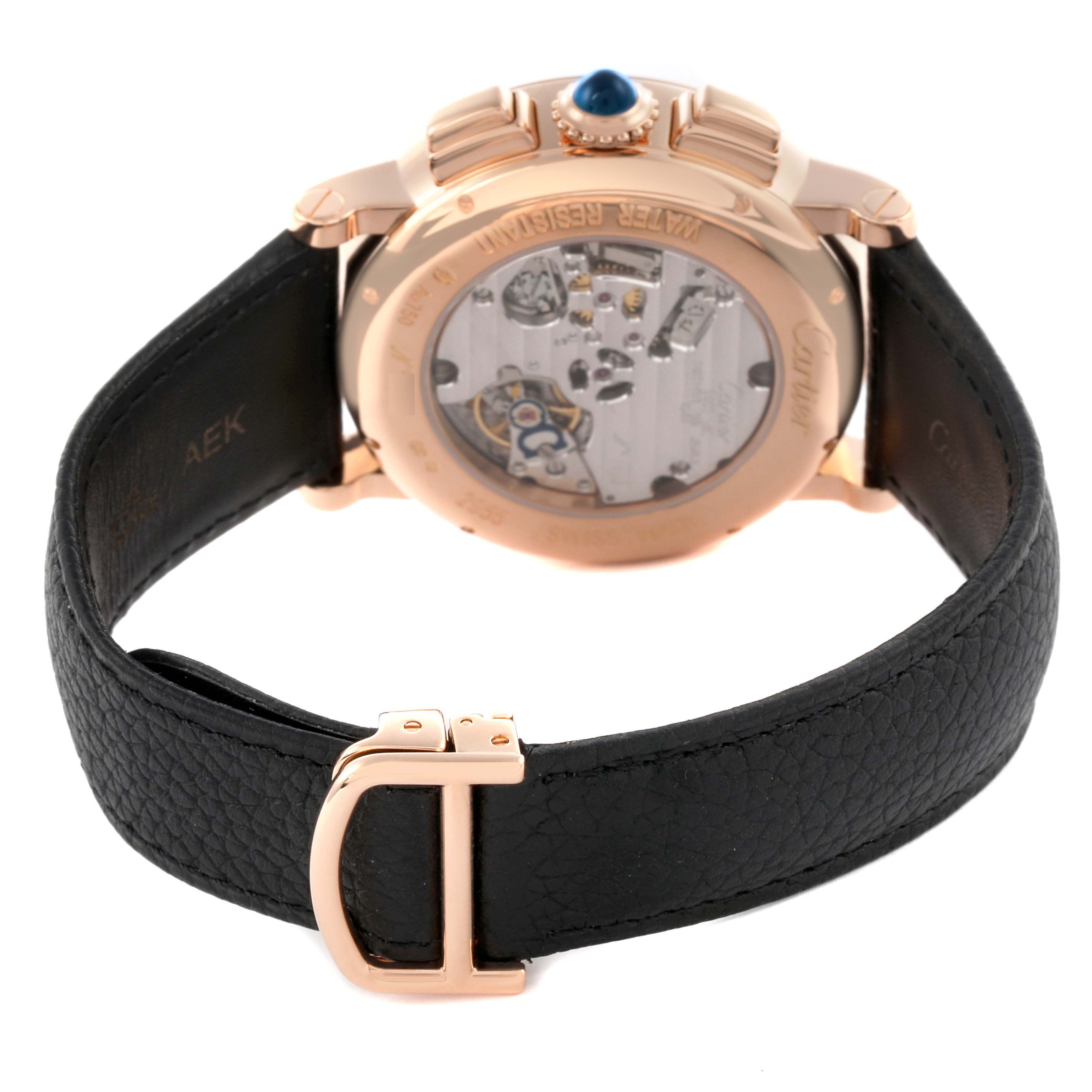 The image shows the back of a Rotonde model by Cartier, highlighting its open case back and black leather strap.