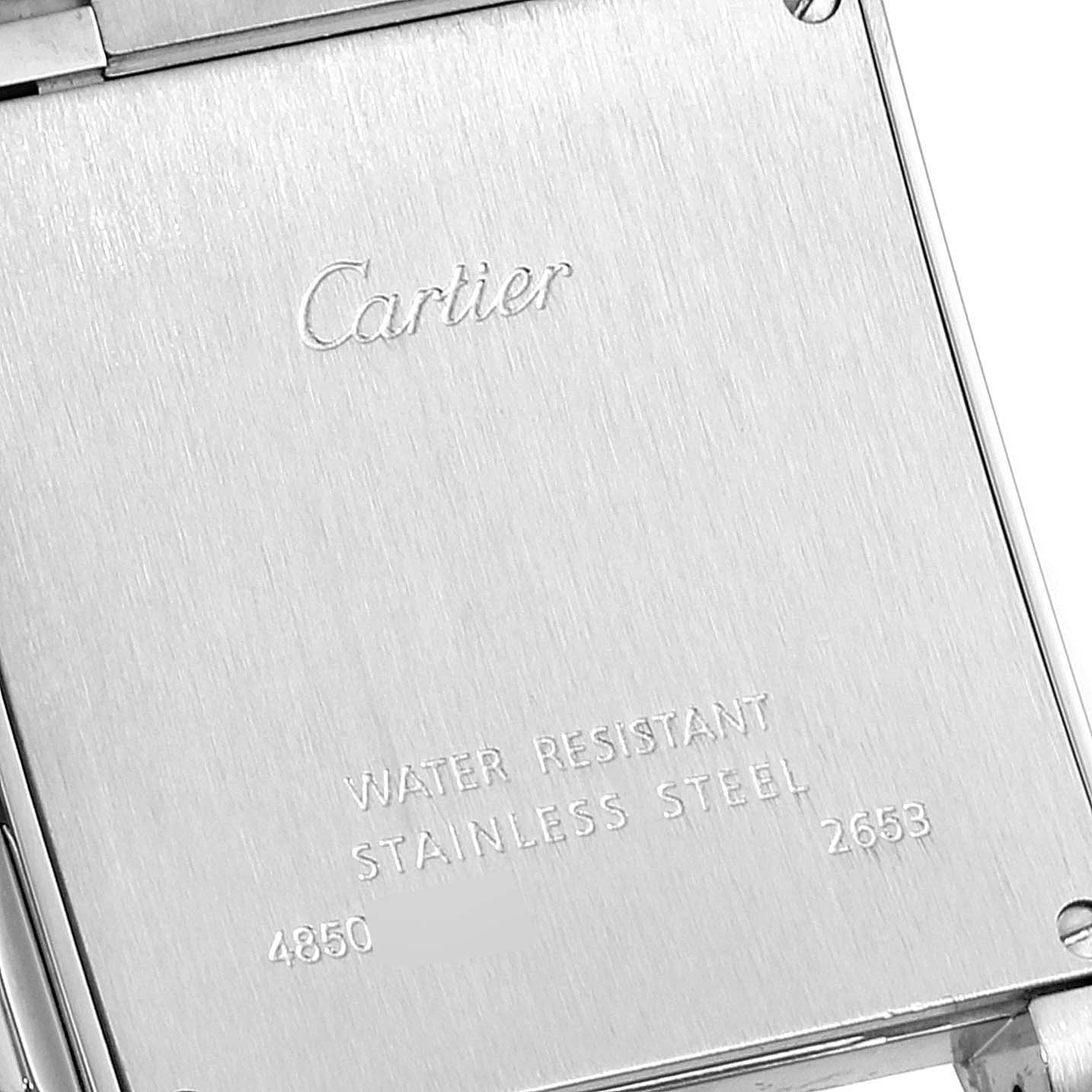 The image shows the case back of a Cartier Tank Francaise W51024Q3 Men's Stainless Steel Silver Dial W51024Q3 Men's Stainless Steel Silver Dial watch, detailing its water resistance and stainless steel material.