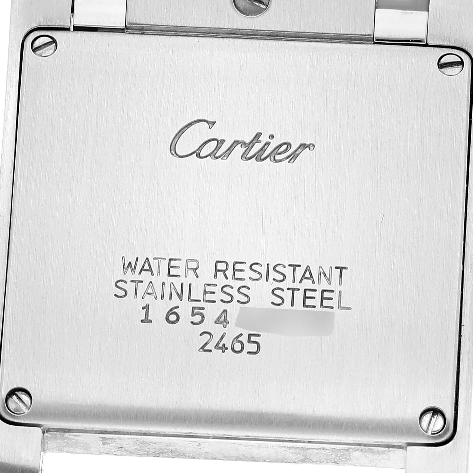 The image shows the case back of a Cartier Tank Francaise W51012Q4 Women
s Steel and Gold (two tone) Silver Dial W51012Q4 Women
s Steel and Gold (two tone) Silver Dial watch, highlighting the engraving and screws.