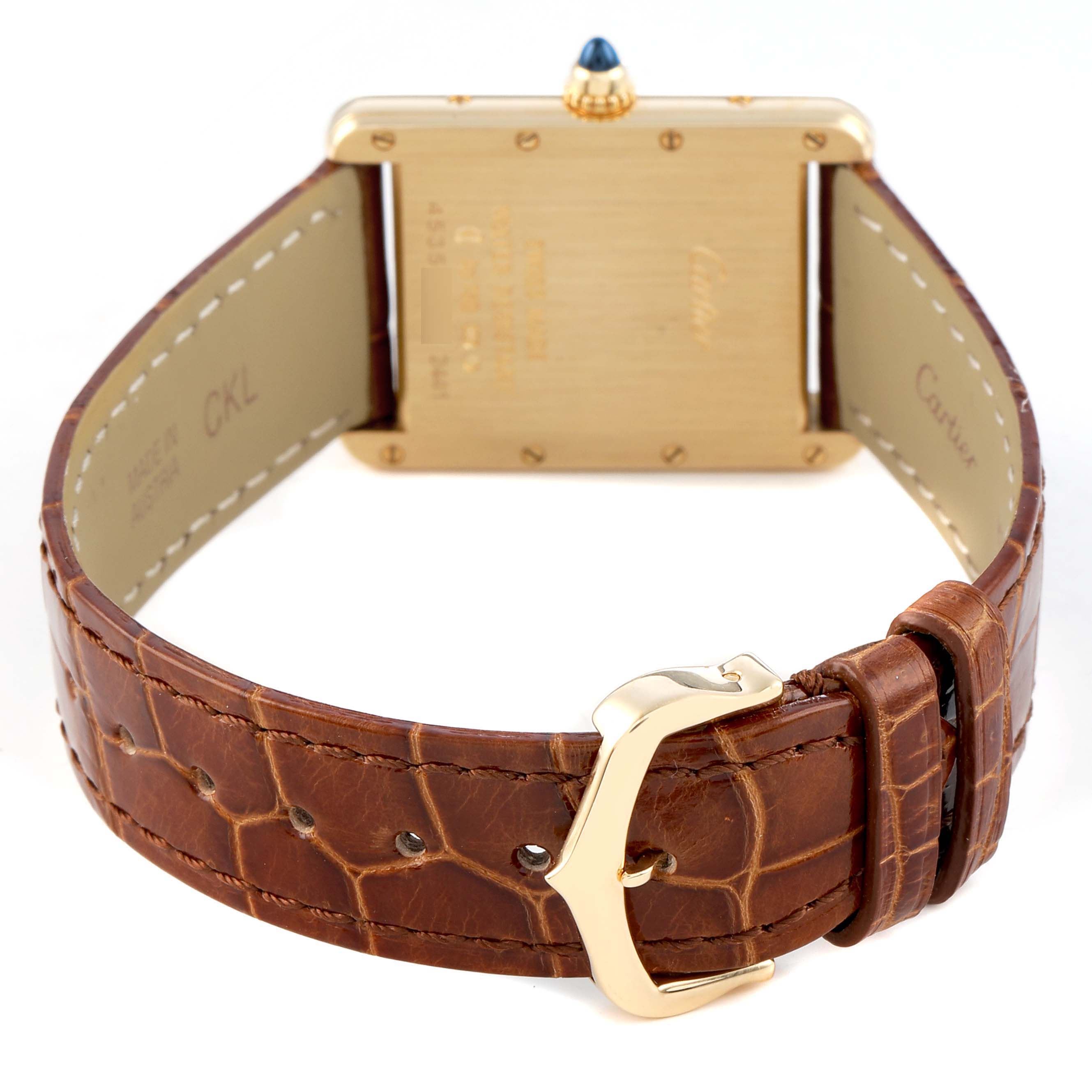 The Cartier Tank Louis W1529756 Men's Yellow Gold Silver Dial watch is shown from the back, highlighting the case, brown leather strap, and gold buckle.