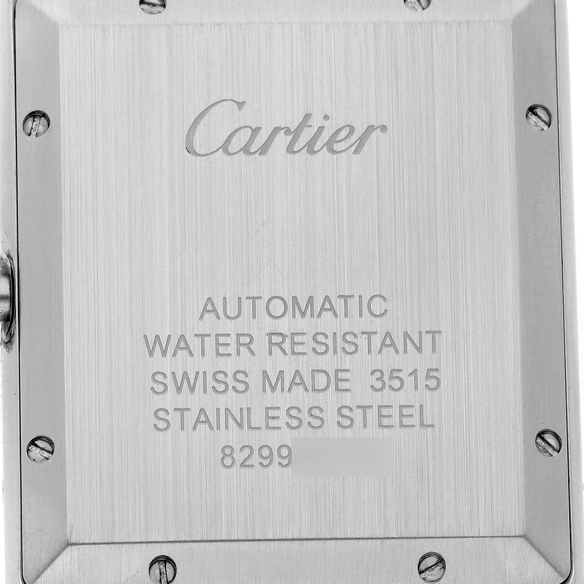 The image shows the back of a Cartier Tank Solo W5200027 Men's Stainless Steel Silver Dial watch with engraved details and screws visible.