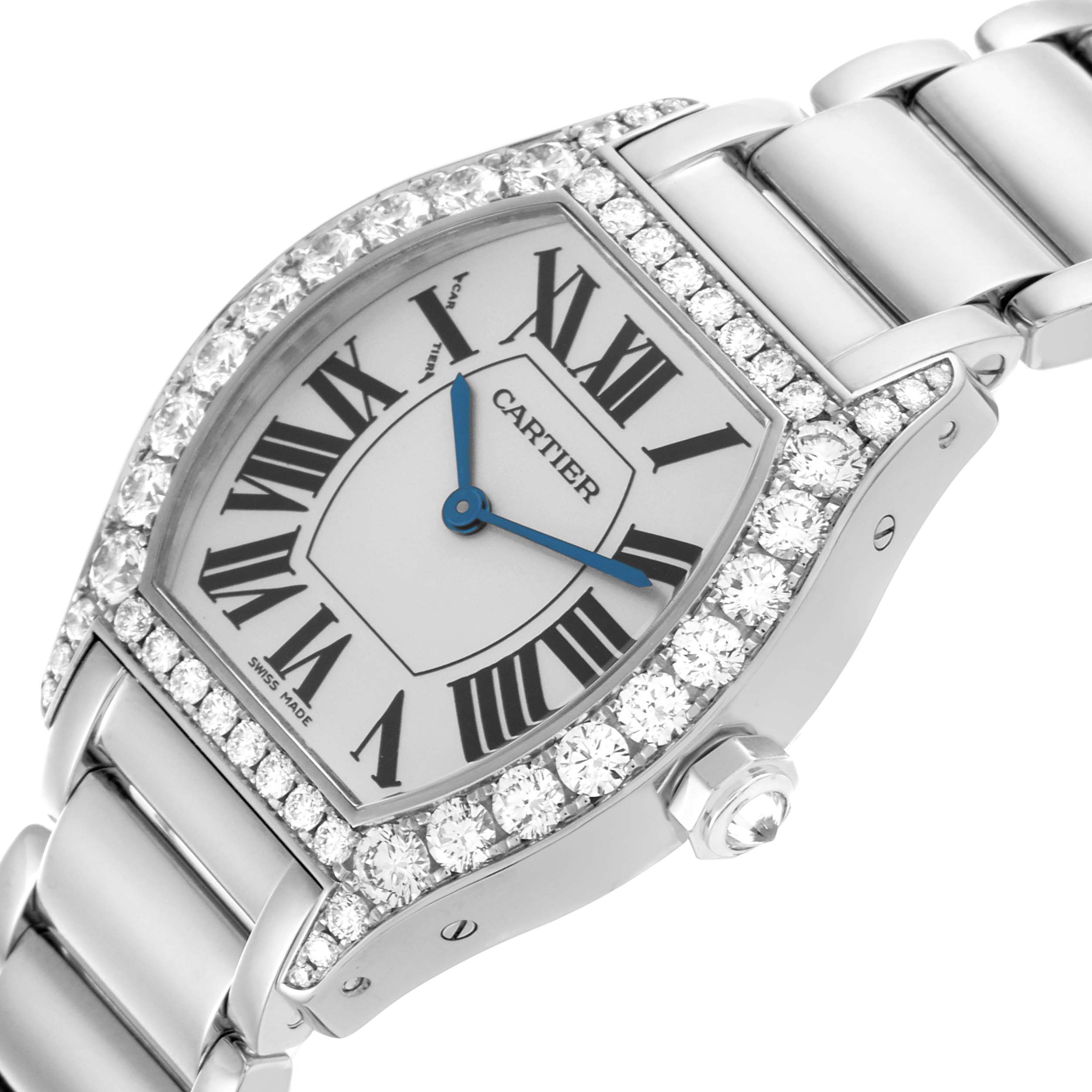 The Cartier Tortue WA5072W9 Women's White Gold Silver Dial WA5072W9 Women's White Gold Silver Dial watch is shown at an angled view, highlighting its dial, diamond bezel, crown, and part of the bracelet.