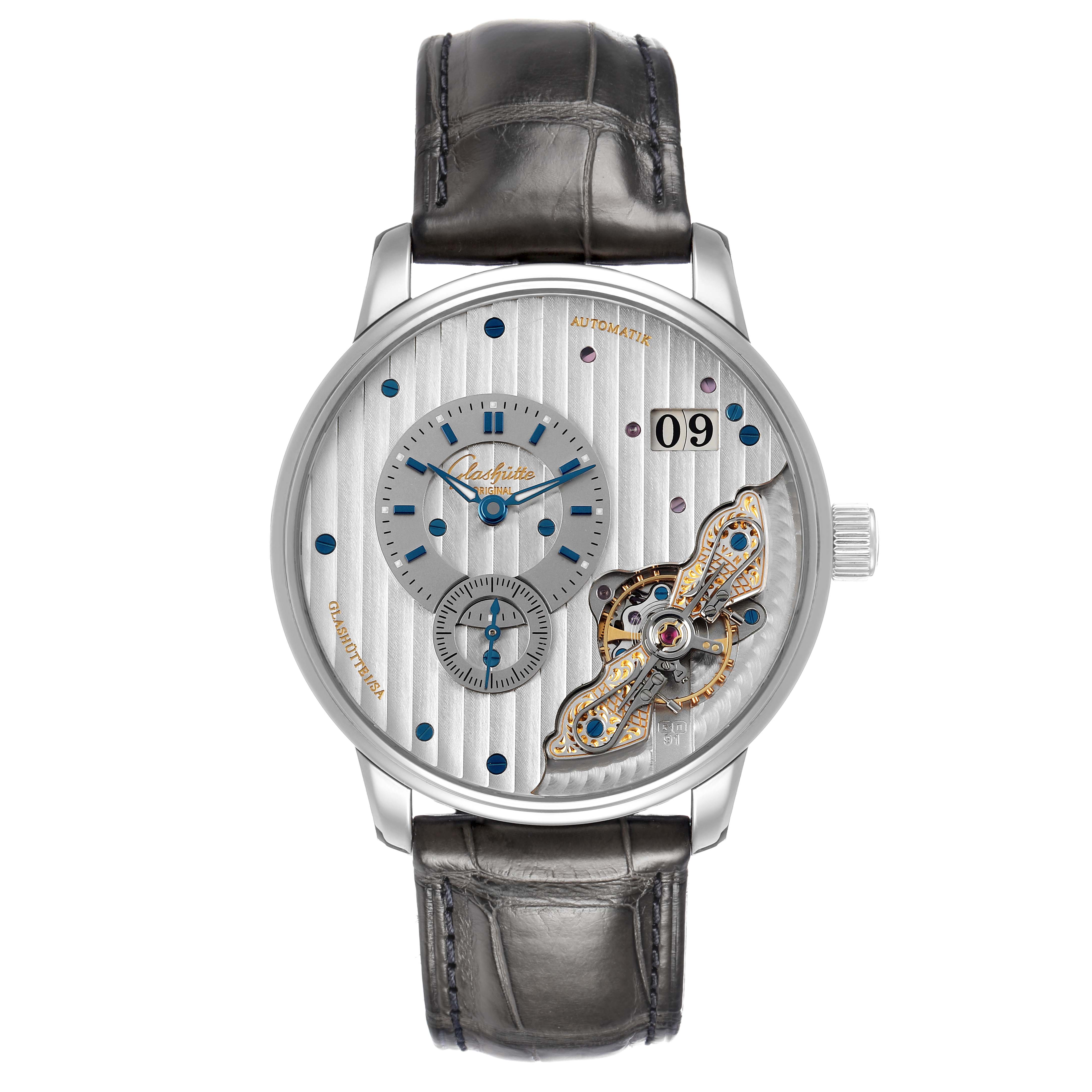 The Glashütte Original watch is shown from a front angle, highlighting the dial, subdials, and date display.