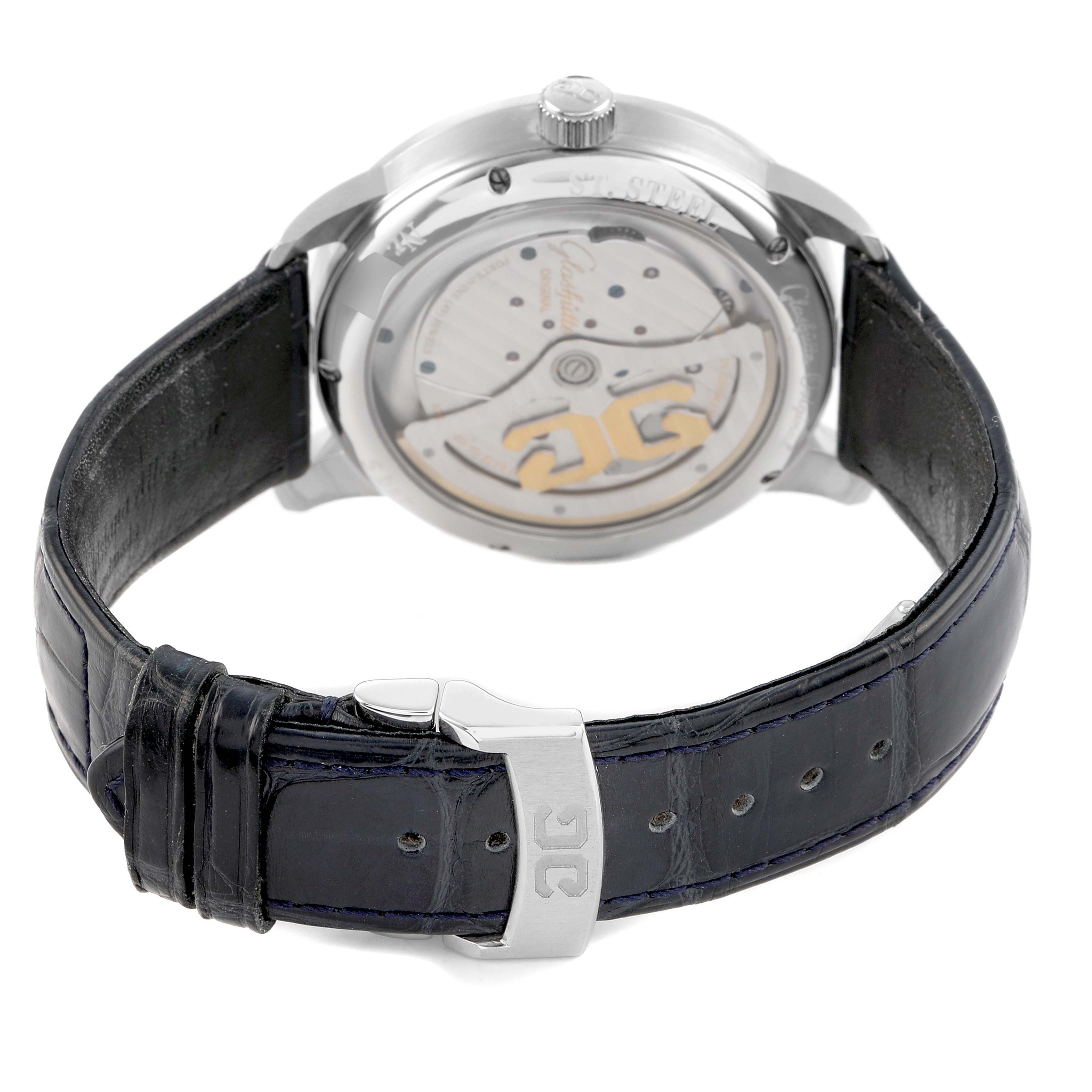 The watch, a Glashütte Original model, is shown from the back angle, highlighting the movement and leather strap with a metal clasp.