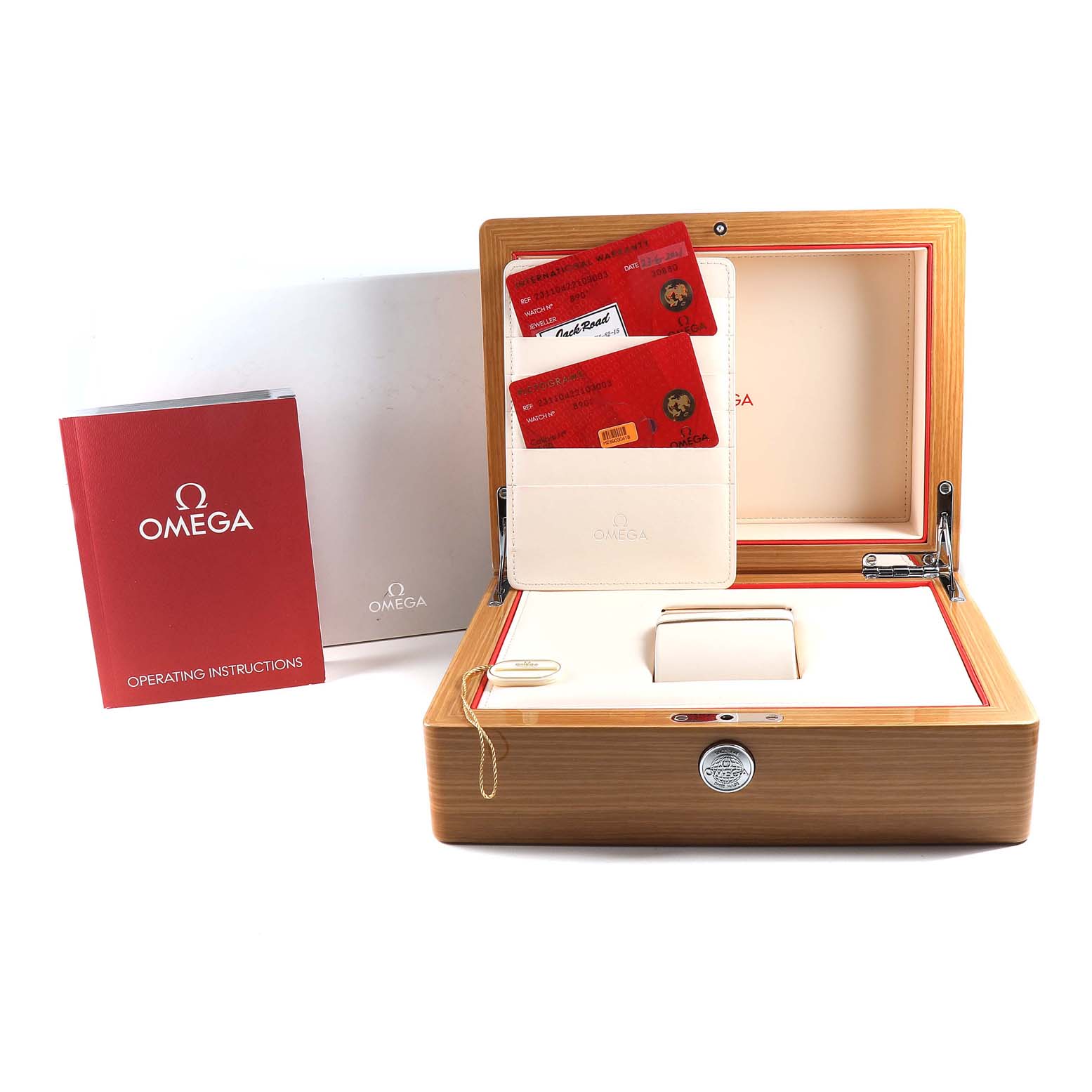 The image shows the accessories of an Omega Aqua Terra 231.10.42.21.03.003 Men
s Stainless Steel Blue Dial 231.10.42.21.03.003 Men
s Stainless Steel Blue Dial watch, including the watch box, warranty cards, and an operating instructions booklet.