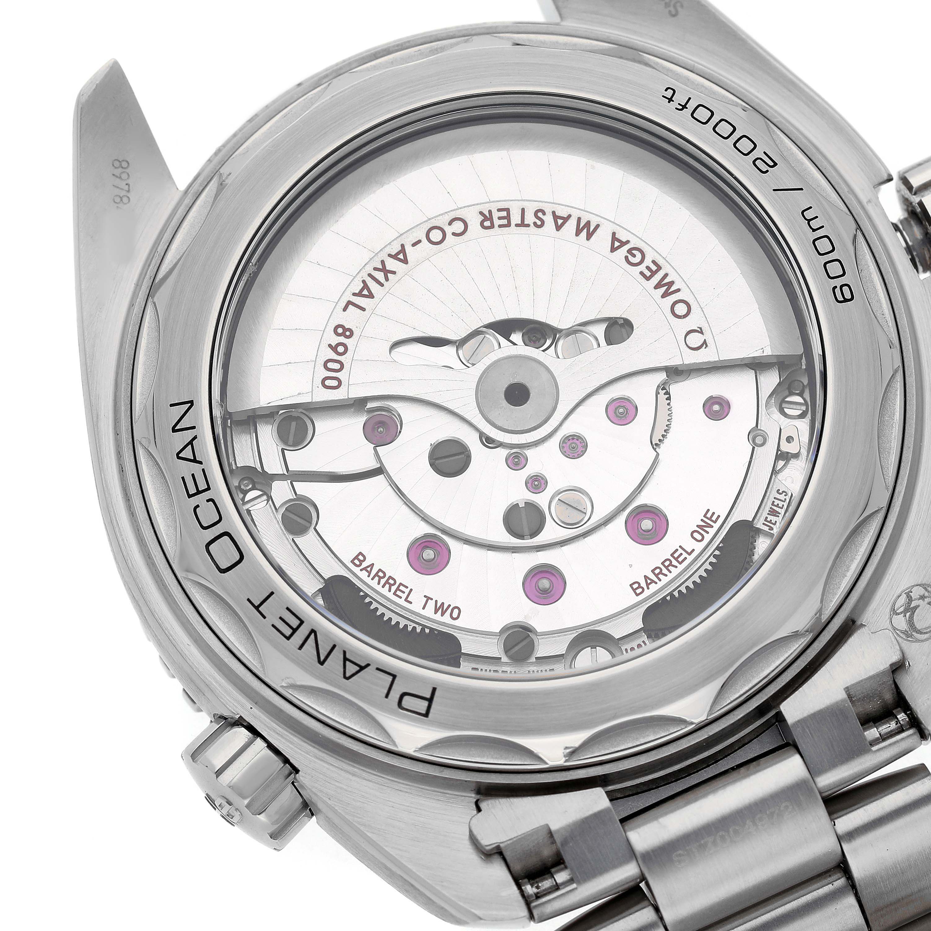 The image shows the back view of an Omega Planet Ocean 215.30.44.21.01.001 Men's Stainless Steel Black Dial watch, displaying its exposed movement and mechanism.