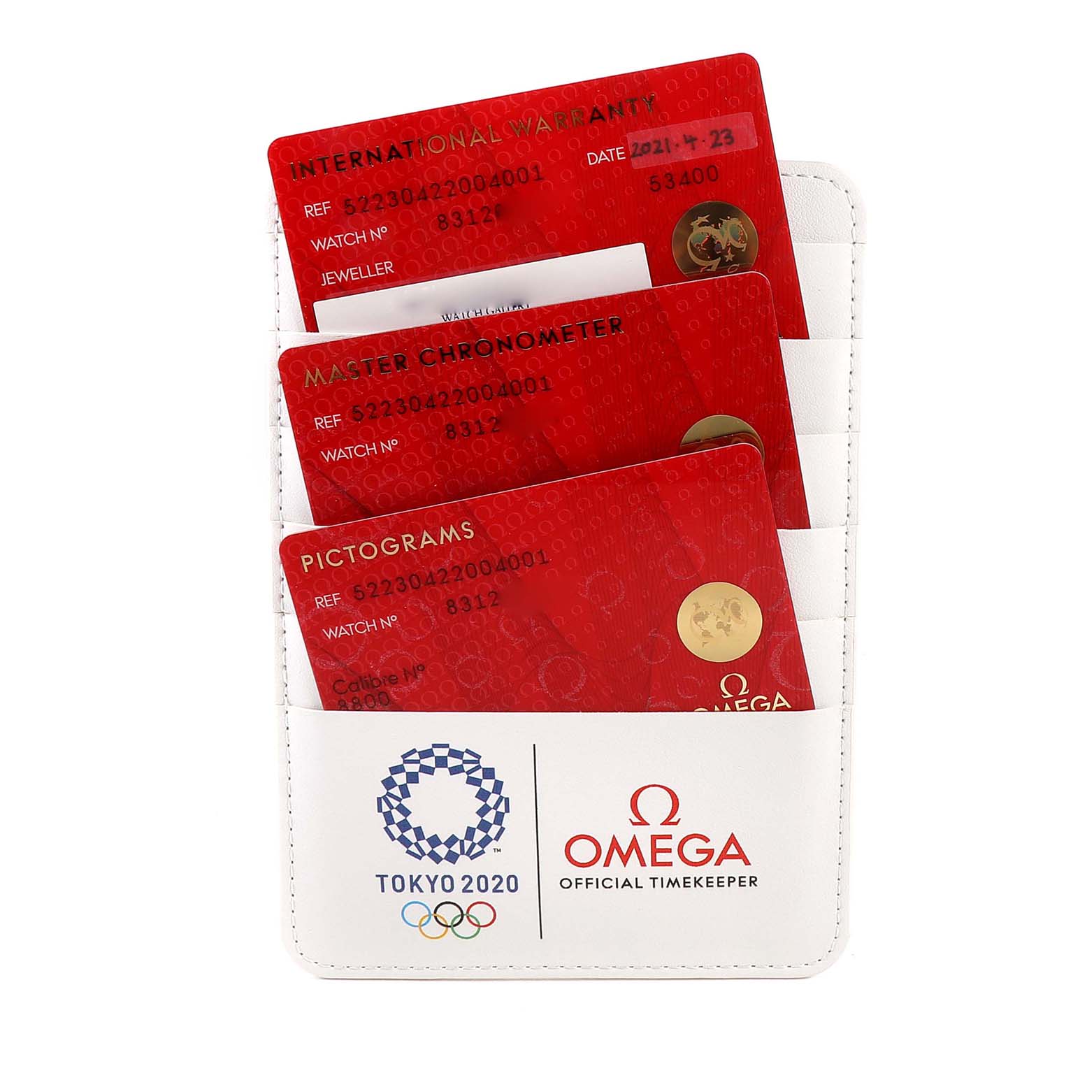 The image shows a white cardholder containing three red warranty and certification cards for the Omega Seamaster 522.30.42.20.04.001 Men's Stainless Steel White Dial 522.30.42.20.04.001 Men's Stainless Steel White Dial model.