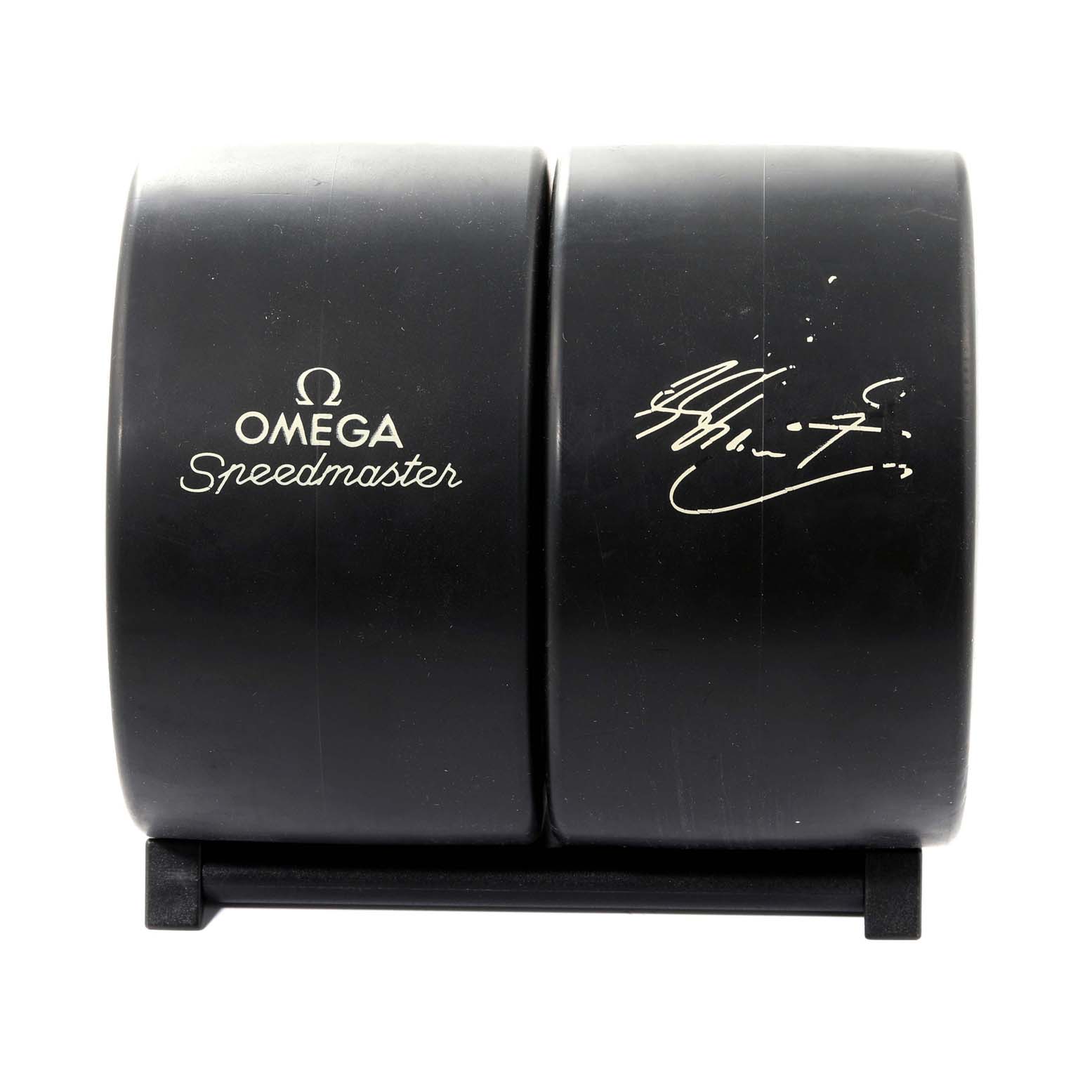 The image shows the black case or box for an Omega Speedmaster 3511.12.00 Men's Stainless Steel Yellow Dial 3511.12.00 Men's Stainless Steel Yellow Dial watch, featuring the brand's logo and a signature.