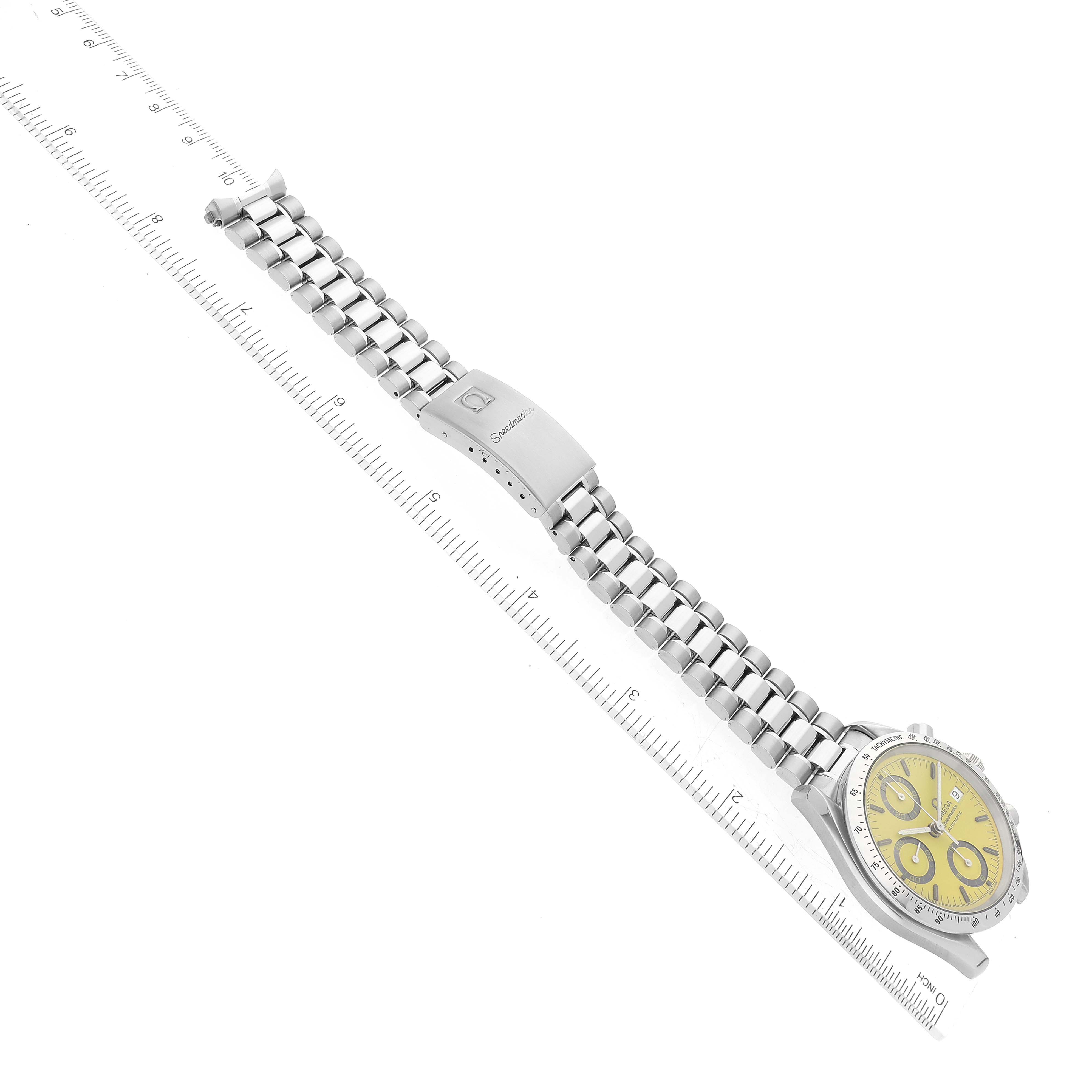The image shows a top-down view of an Omega Speedmaster 3511.12.00 Men's Stainless Steel Yellow Dial 3511.12.00 Men's Stainless Steel Yellow Dial watch, highlighting its bracelet and clasp.