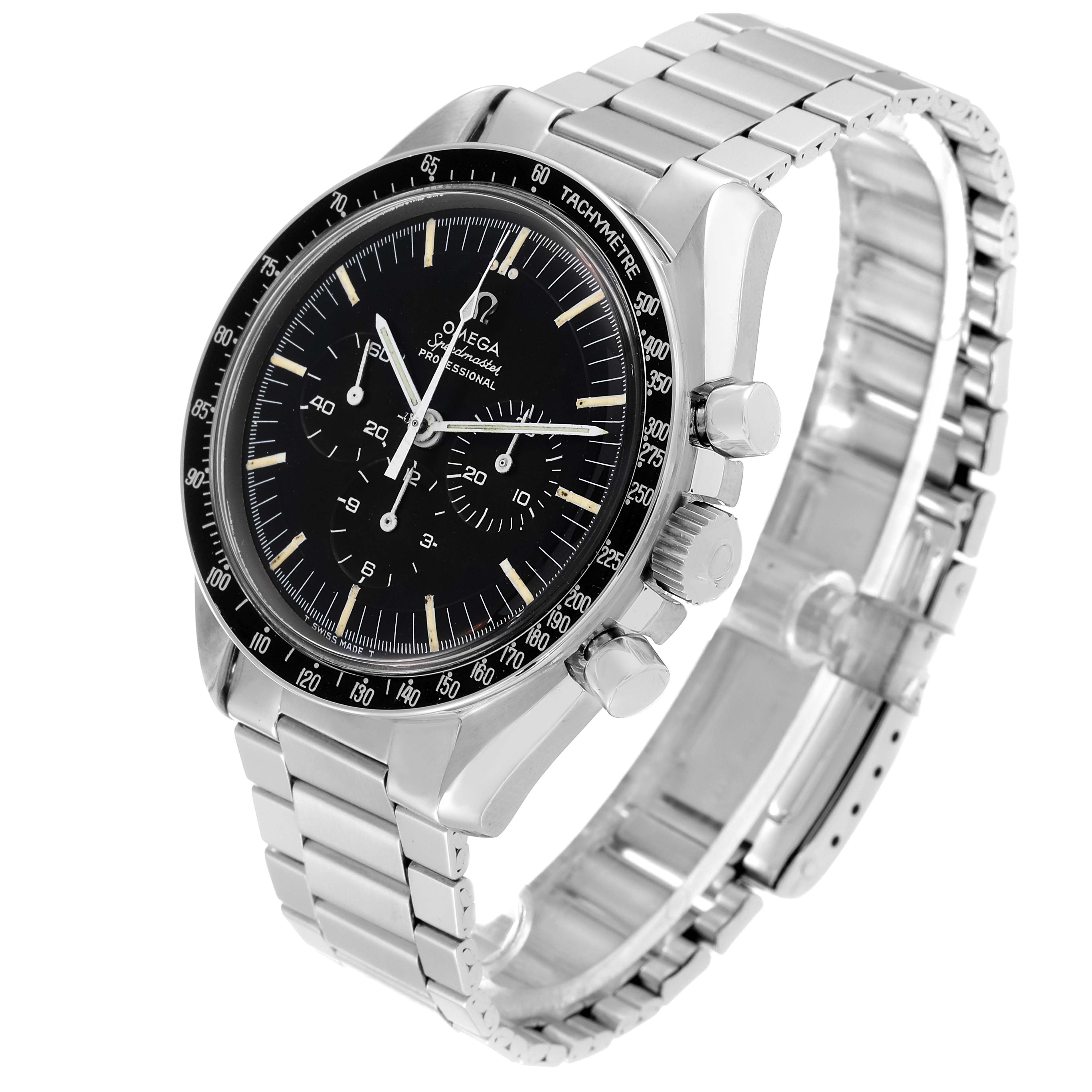The image shows an angled view of an Omega Speedmaster 145.012-67 Men's Stainless Steel Black Dial 145.012-67 Men's Stainless Steel Black Dial watch highlighting the black dial, tachymeter bezel, and stainless steel bracelet.