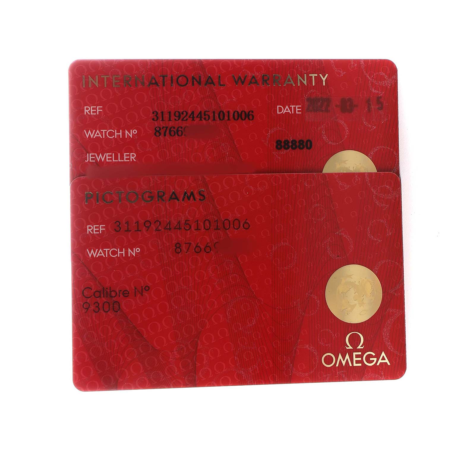 The image shows two Omega Speedmaster 311.92.44.51.01.006 Men's Ceramic Black Dial cards: an International Warranty card and a Pictograms card.
