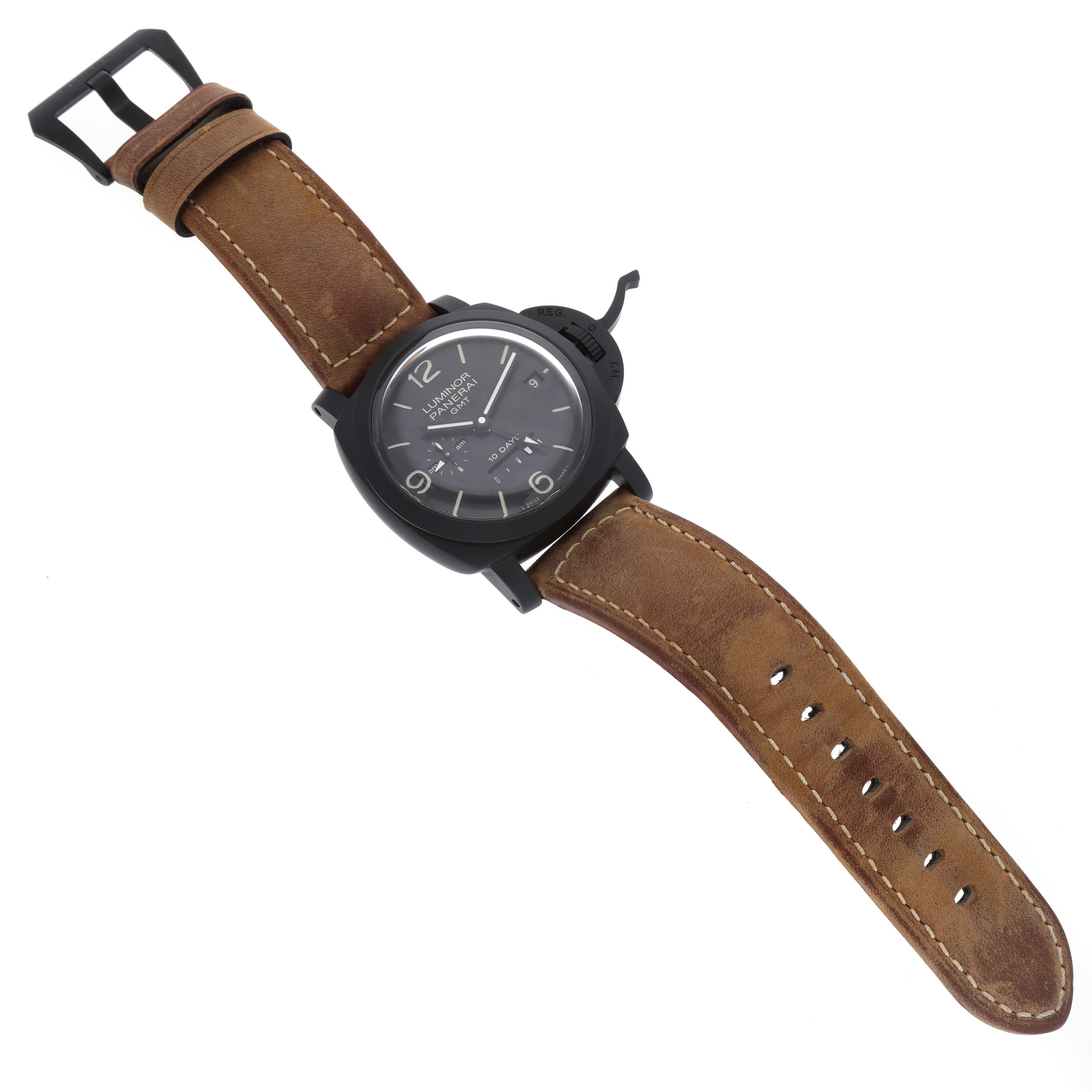 The image shows a Panerai Luminor PAM00335 Men's Ceramic Black Dial watch angled slightly from above, highlighting the dial, case, strap, and buckle.