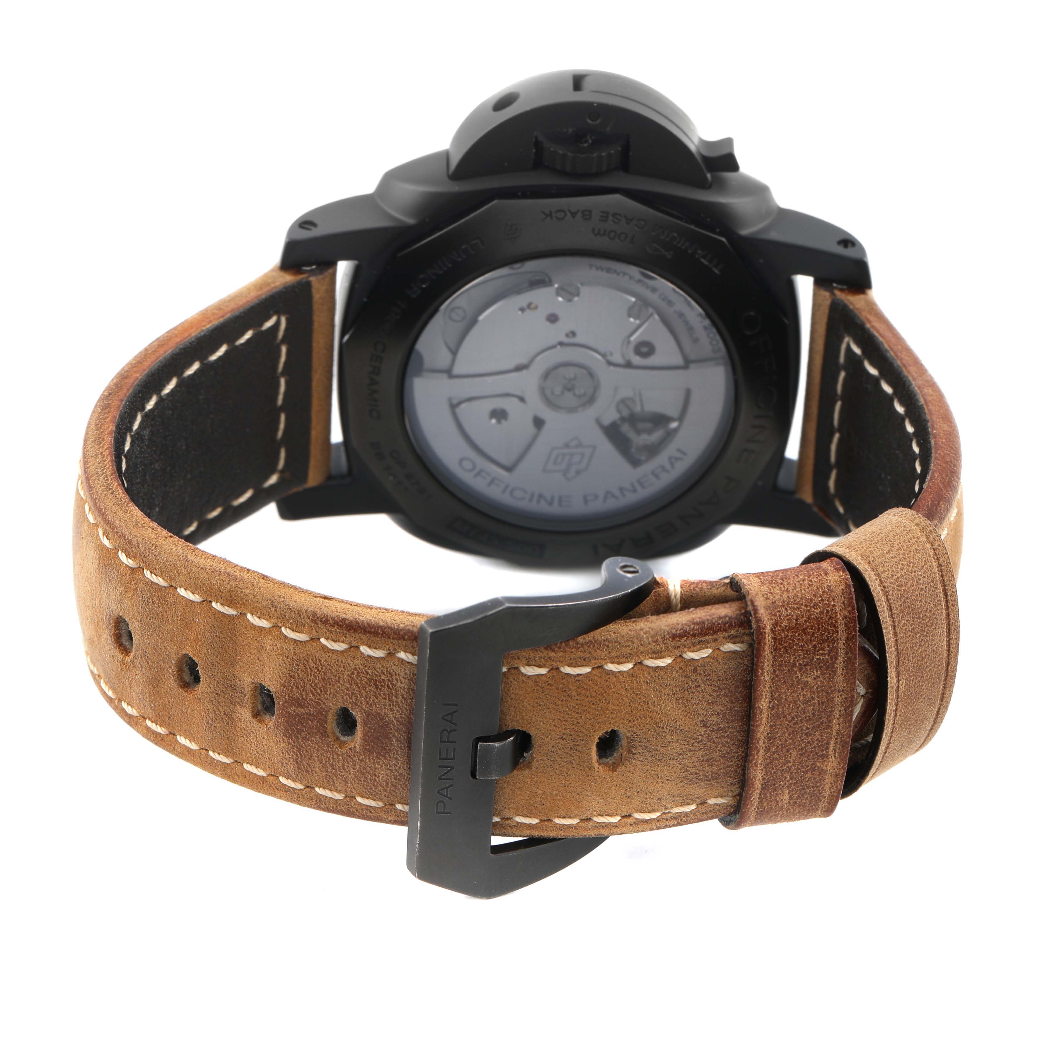 The image shows the back of a Panerai Luminor PAM00335 Men's Ceramic Black Dial watch with its open case back, leather strap, and buckle.