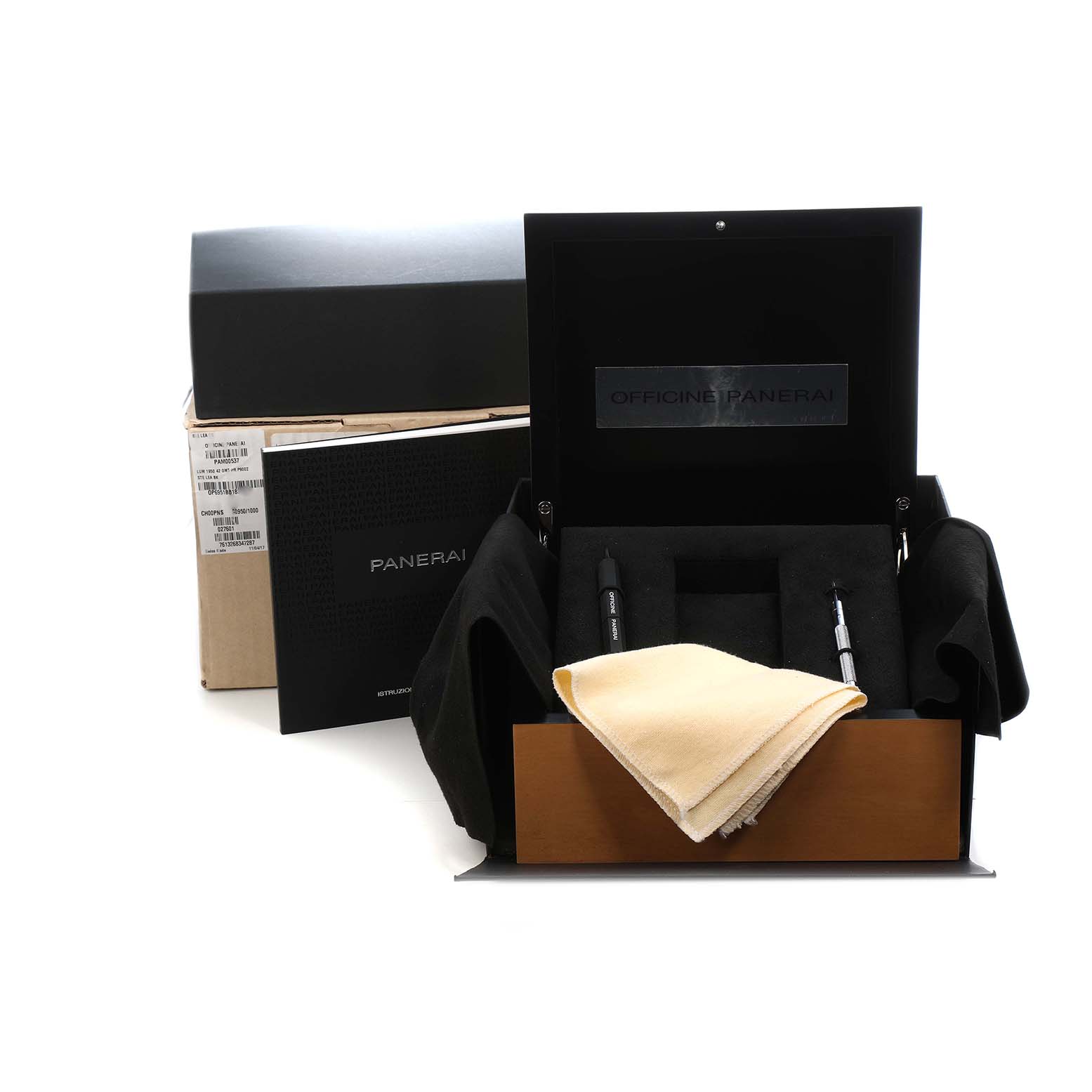 The image shows an open Panerai Luminor PAM00537 Men's Stainless Steel Black Dial box with tools, a cloth, and packaging materials displayed from the front angle.