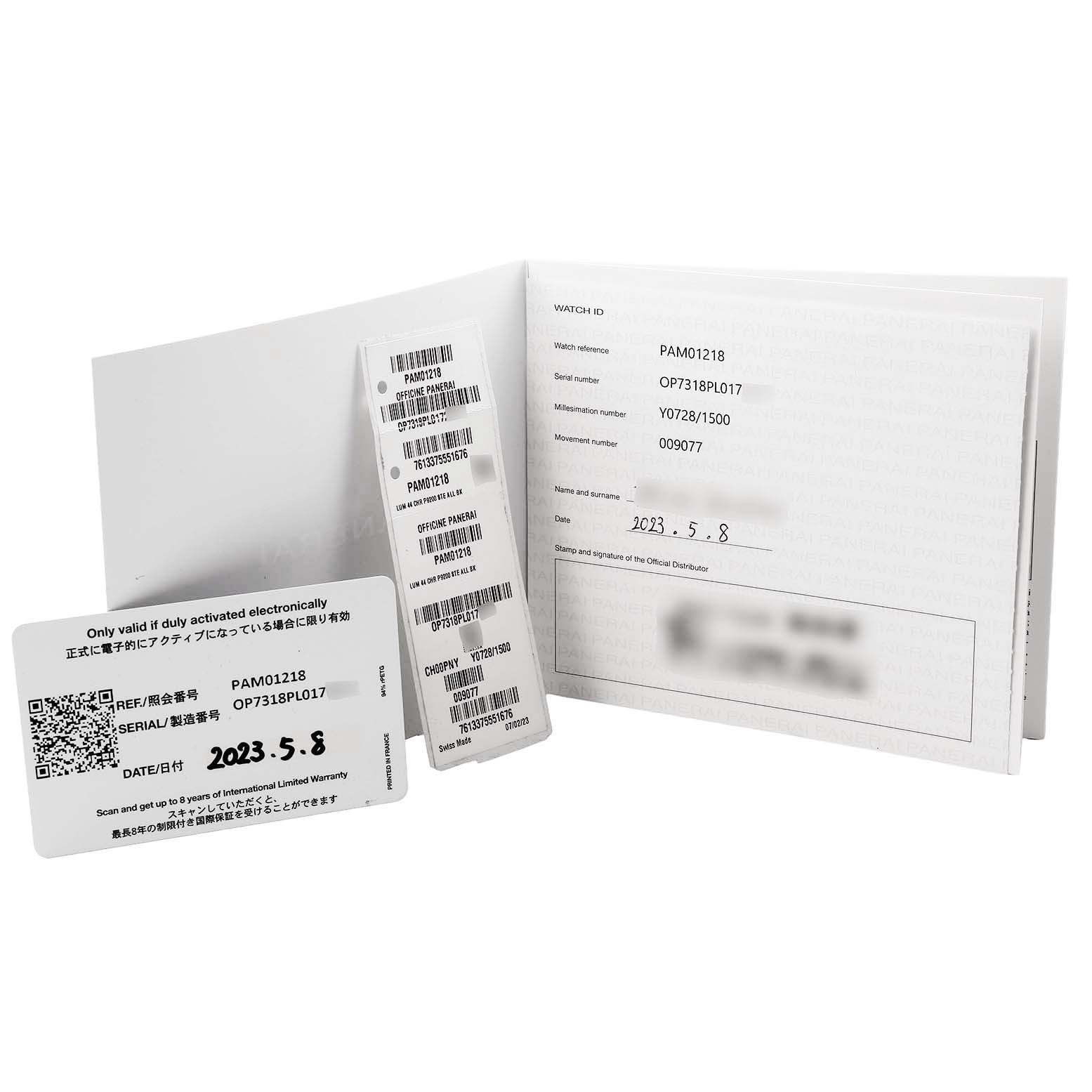 The image shows documentation and tags for a Panerai Luminor PAM01218 Men's Stainless Steel White Dial watch, including a warranty card and serial number tags.