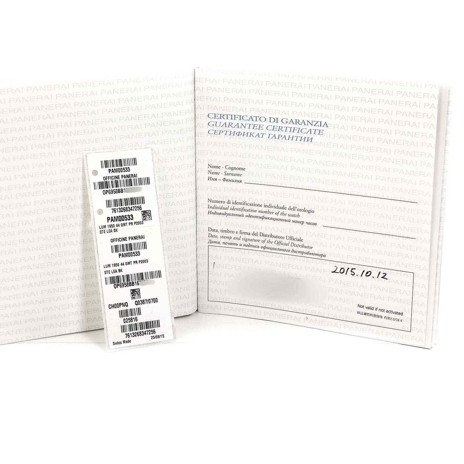 The image shows a Panerai Luminor PAM00533 Men's Stainless Steel Black Dial model warranty certificate booklet and a tag, displayed open at an angle.