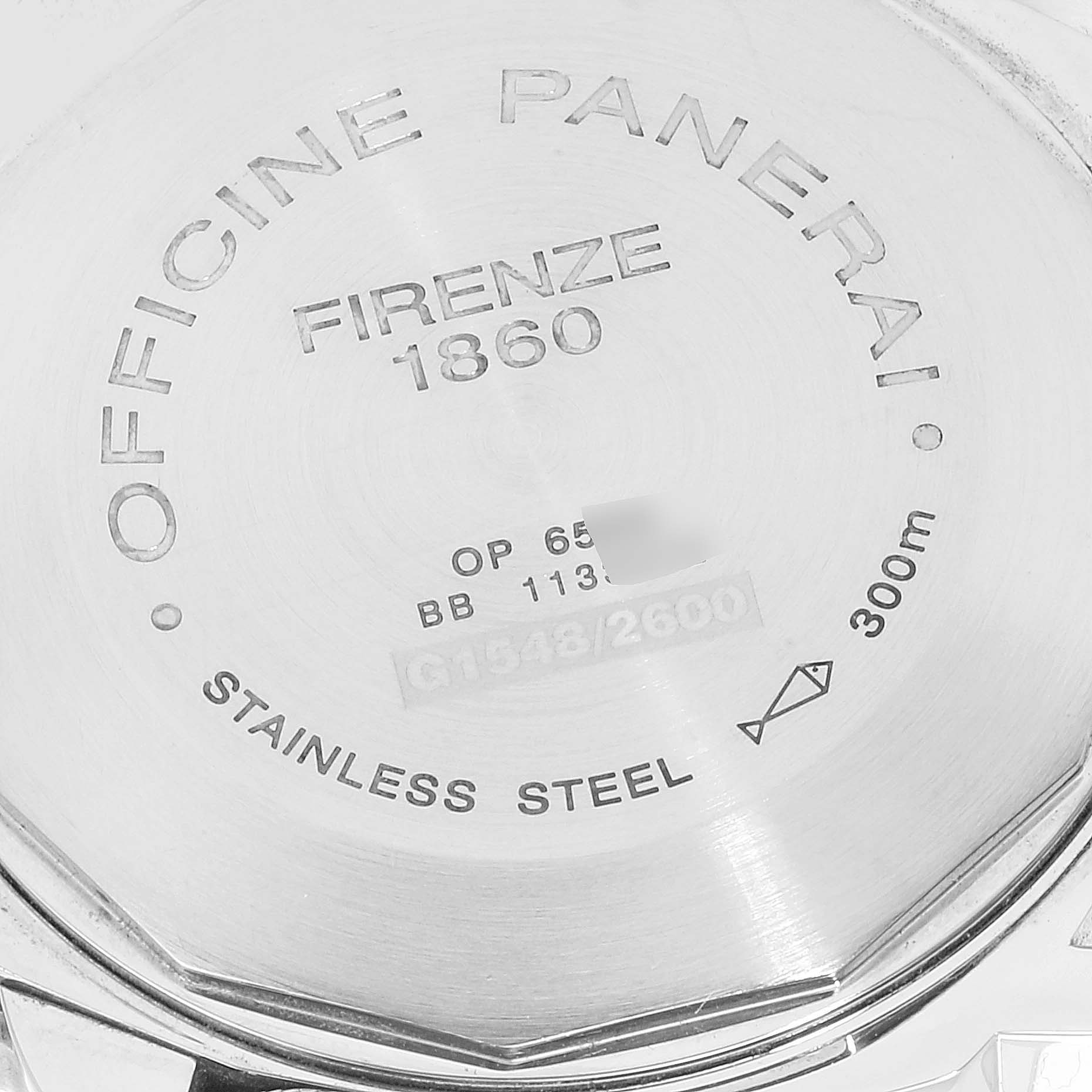 The image shows the back case of a Panerai Luminor PAM00104 Men
s Stainless Steel Black Dial PAM00104 Men
s Stainless Steel Black Dial watch, highlighting its engravings and material details.