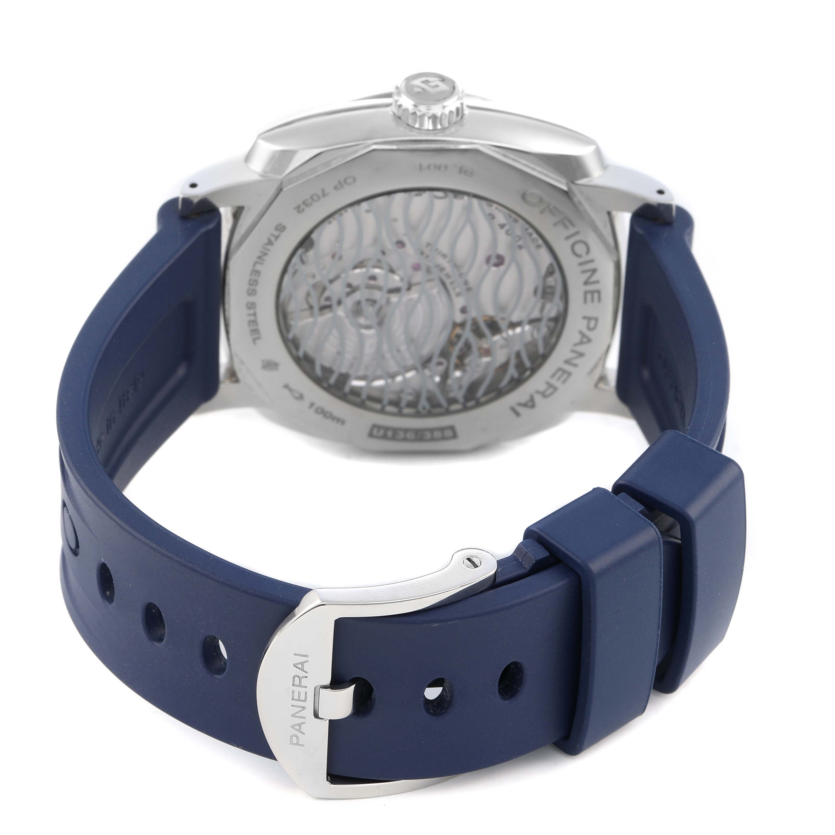 The image shows the back of a Panerai Radiomir PAM00946 Men's Stainless Steel Blue Dial watch, highlighting its transparent case back and blue strap with a buckle.