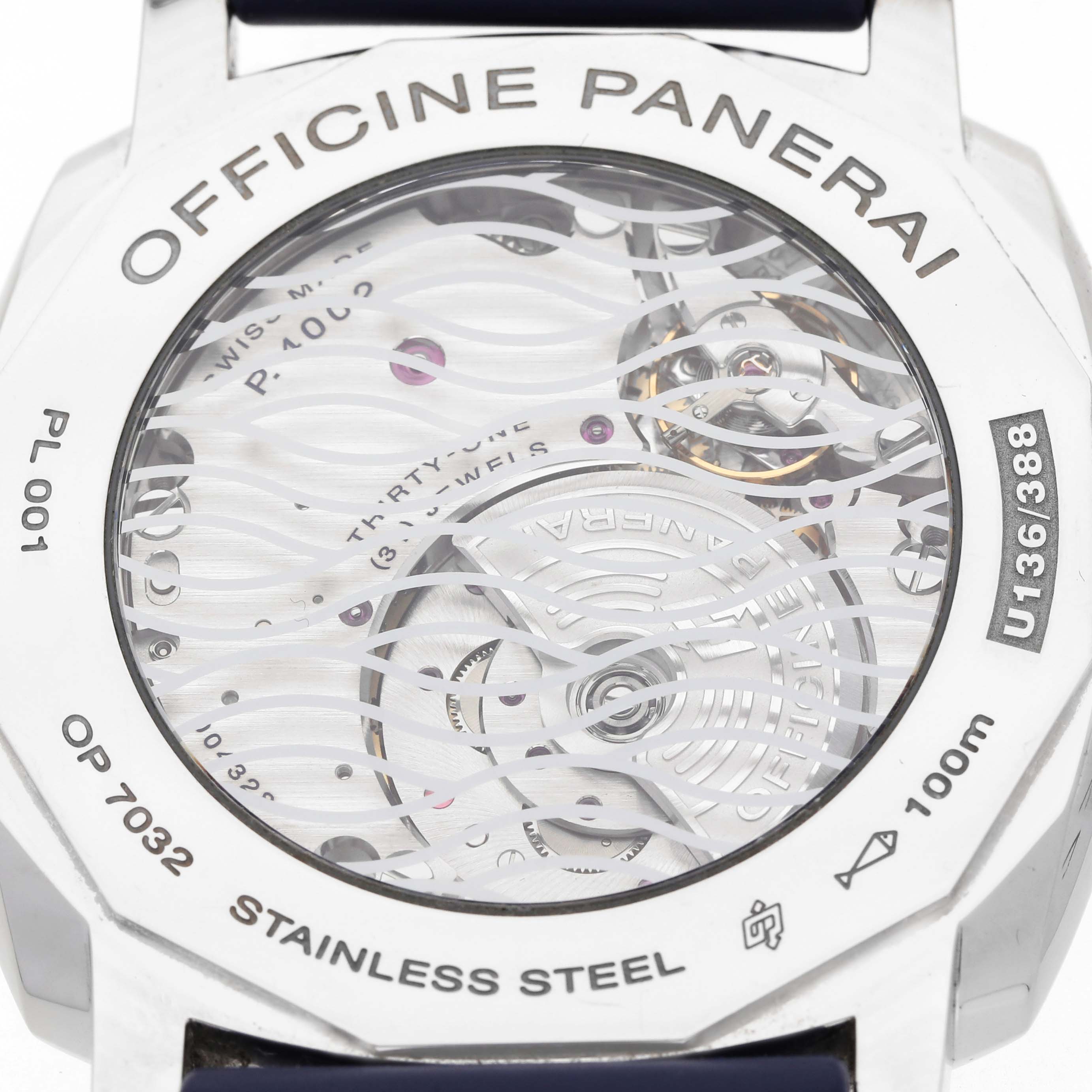 The image shows the back view of a Panerai Radiomir PAM00946 Men's Stainless Steel Blue Dial watch, featuring its transparent case back and visible movement.