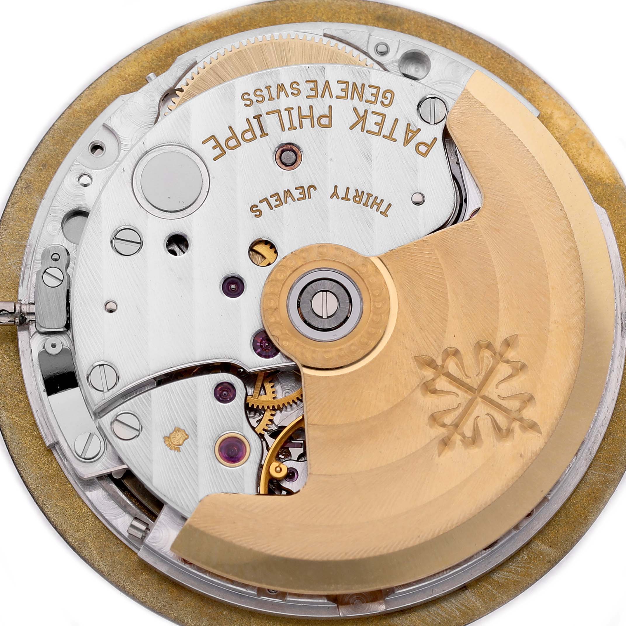 The image shows the movement of a Patek Philippe Nautilus 3710 Men's Stainless Steel Black Dial watch, focusing on the rotor and mechanical components.