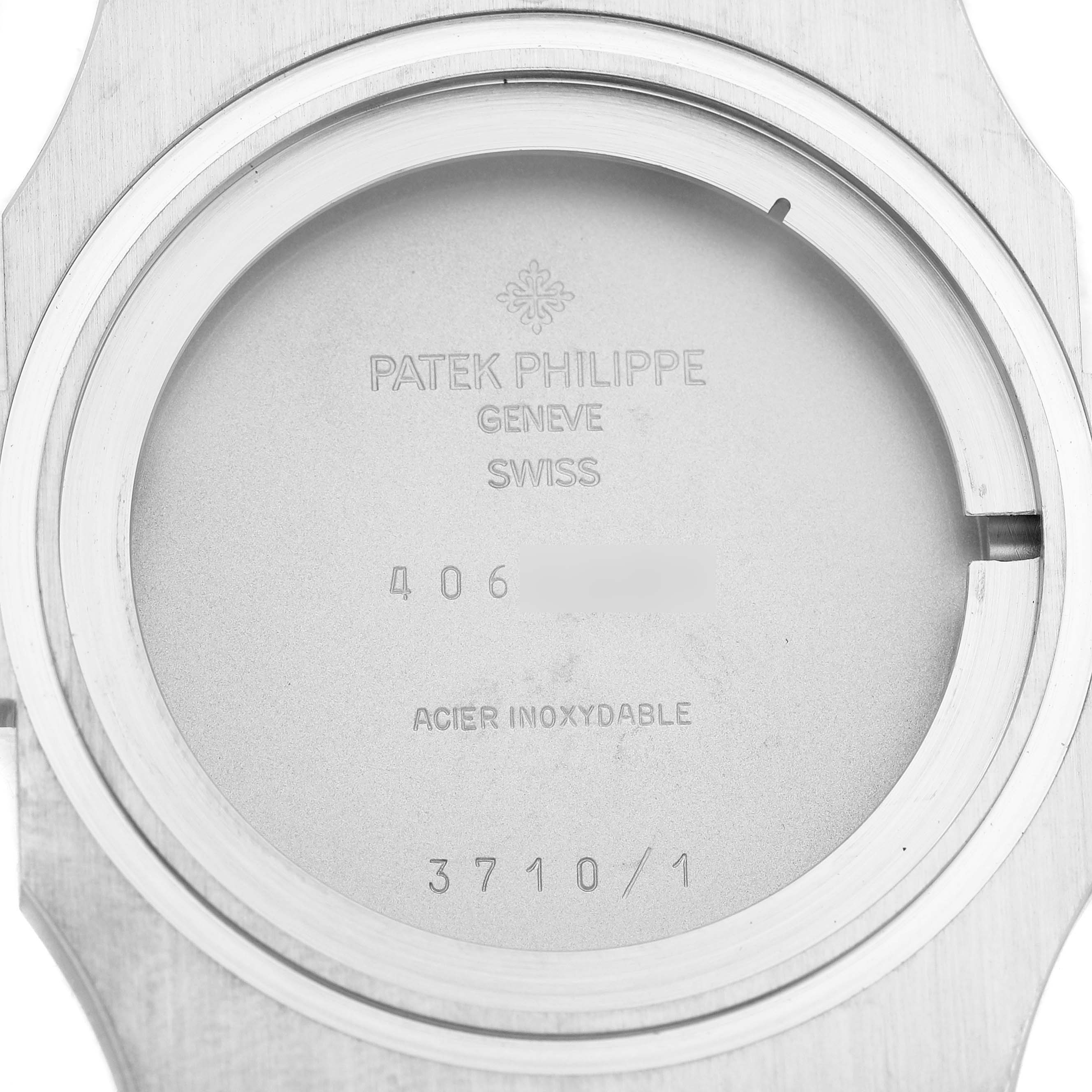 This image shows the back case of a Patek Philippe Nautilus 3710 Men's Stainless Steel Black Dial watch, displaying branding and model details.