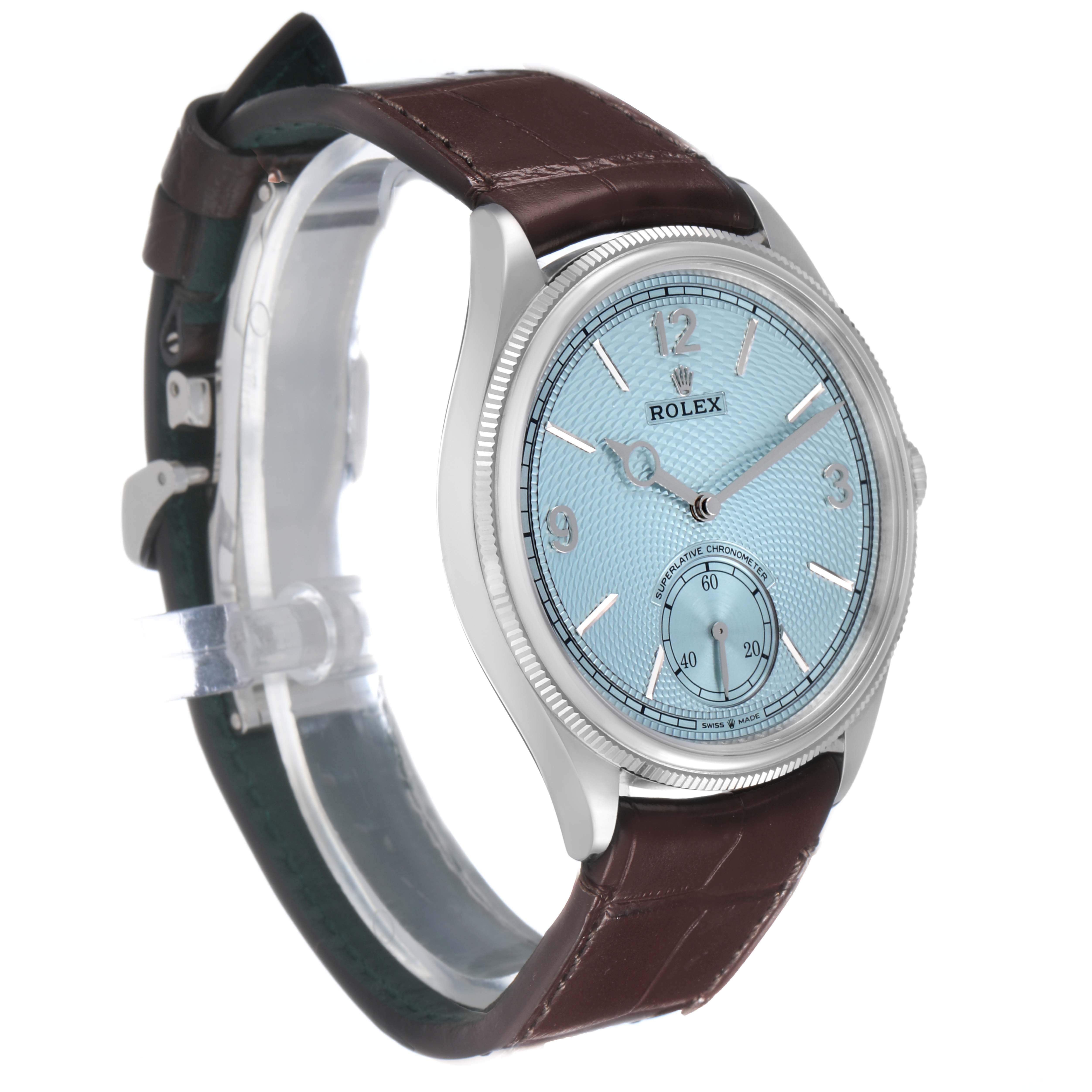 The Rolex 1908 52506 Men's Platinum Blue Dial model is shown at a three-quarter angle, displaying its blue dial and brown leather strap.