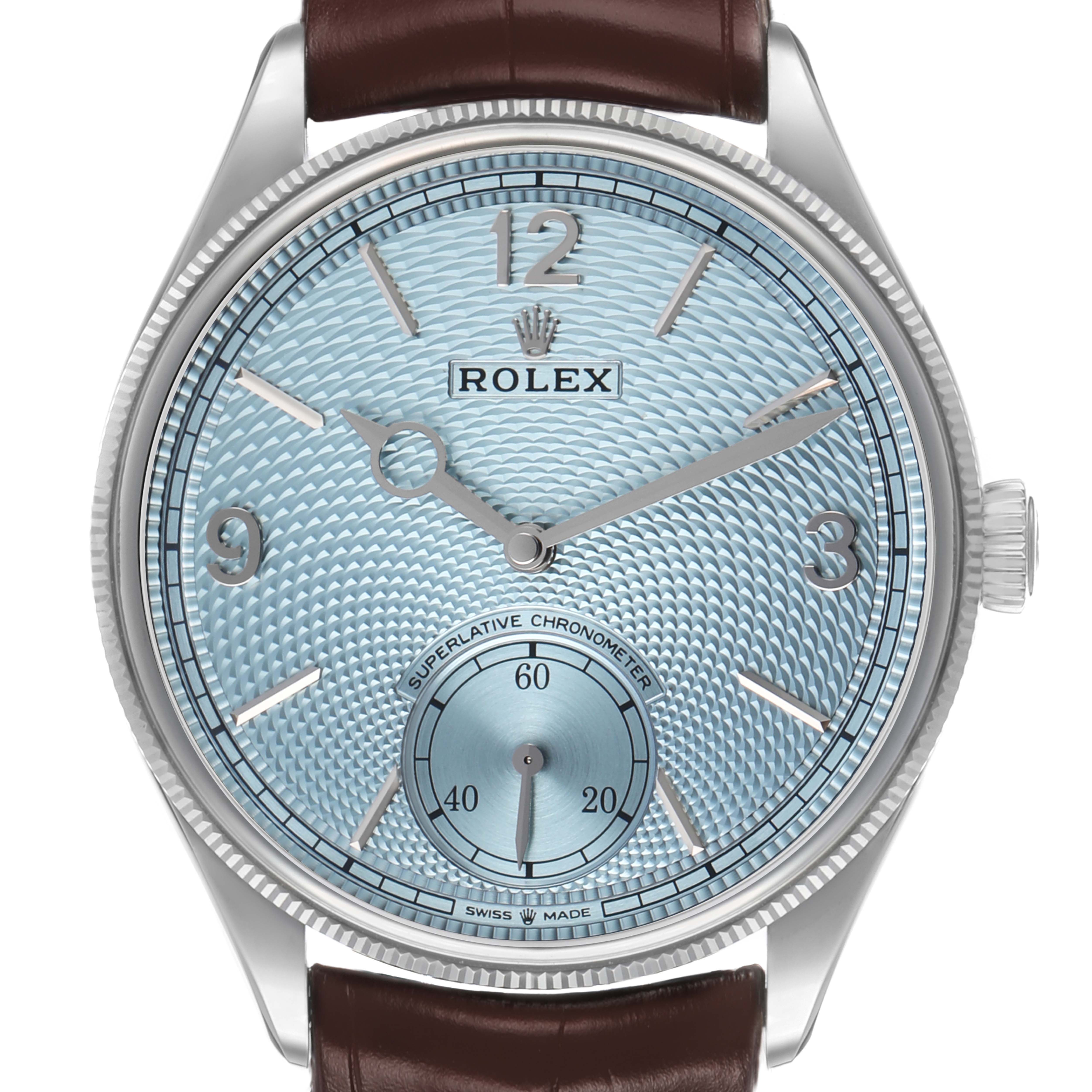 The Rolex 1908 52506 Men's Platinum Blue Dial model is shown from the front, displaying the dial, hands, crown, and leather strap.