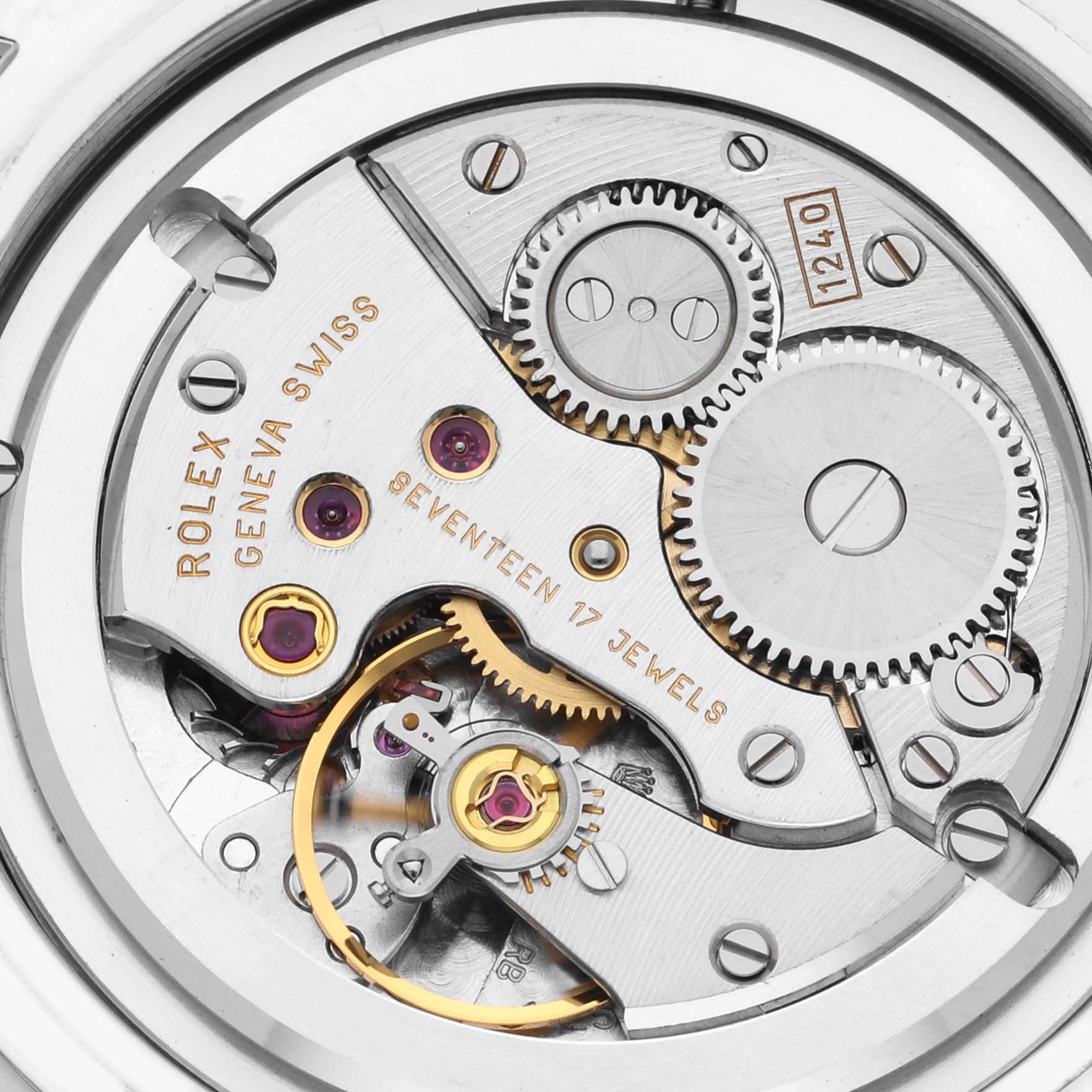 The image shows the movement parts of a Rolex Cellini 5241 Men's Platinum Blue Dial 5241 Men's Platinum Blue Dial watch, displaying gears and jewels from a top-down angle.