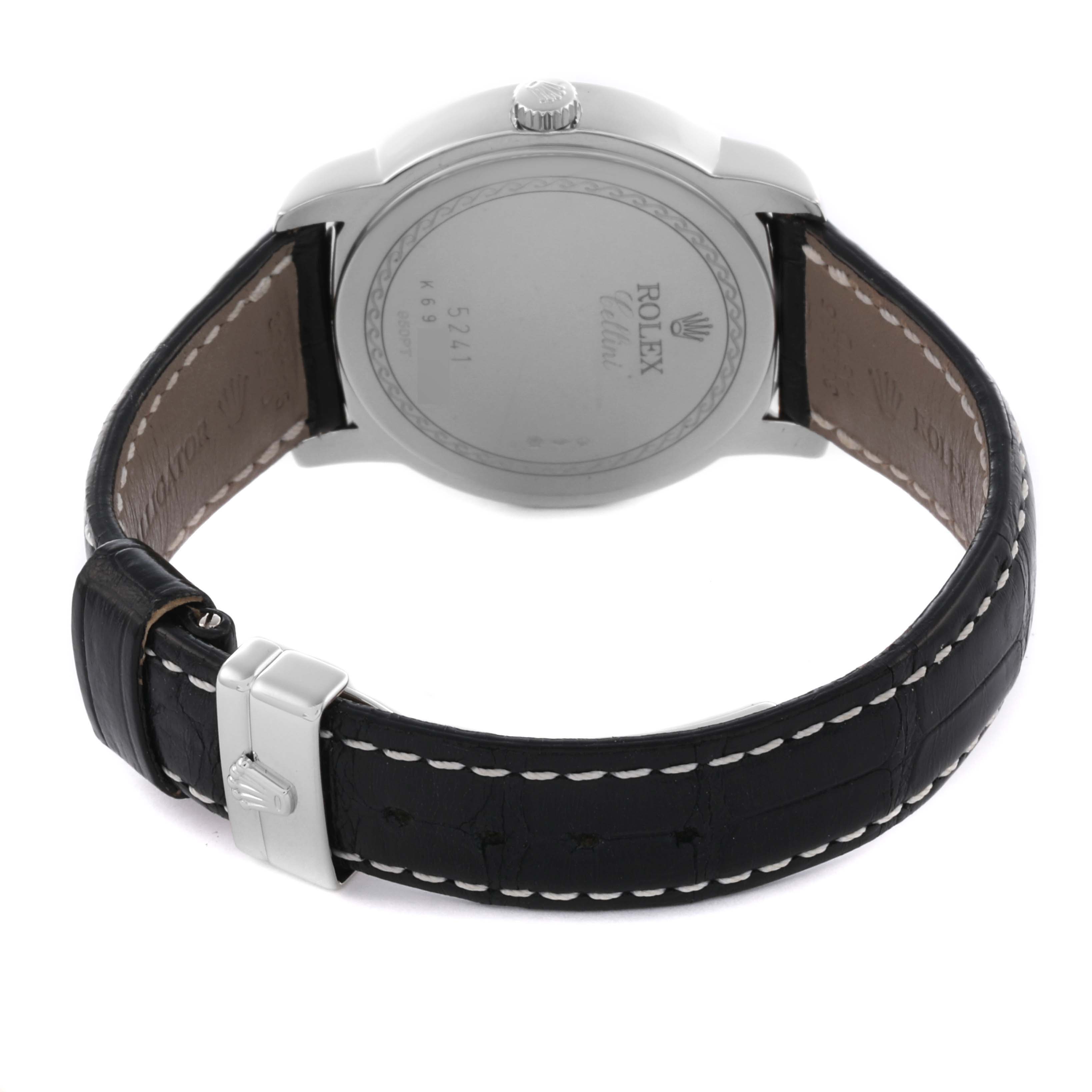 The Rolex Cellini 5241 Men's Platinum Blue Dial 5241 Men's Platinum Blue Dial watch is shown from the back, highlighting the case back and black leather strap with a metal clasp.