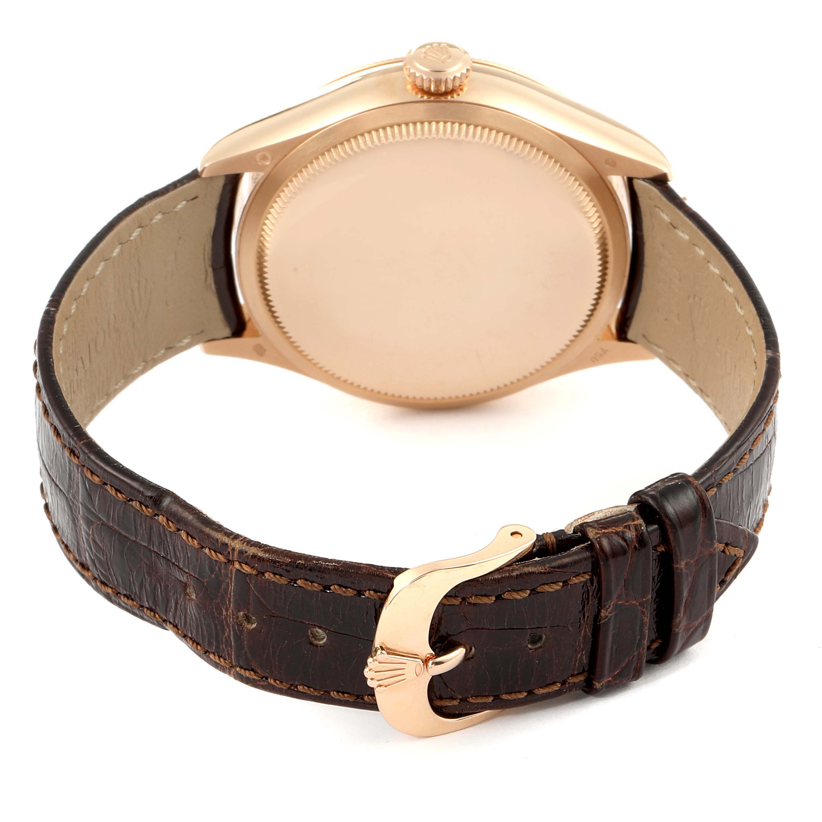 The image shows the back view of a Rolex Cellini 50525 Men
s Rose Gold Silver Dial 50525 Men
s Rose Gold Silver Dial watch, highlighting its leather strap and buckle.