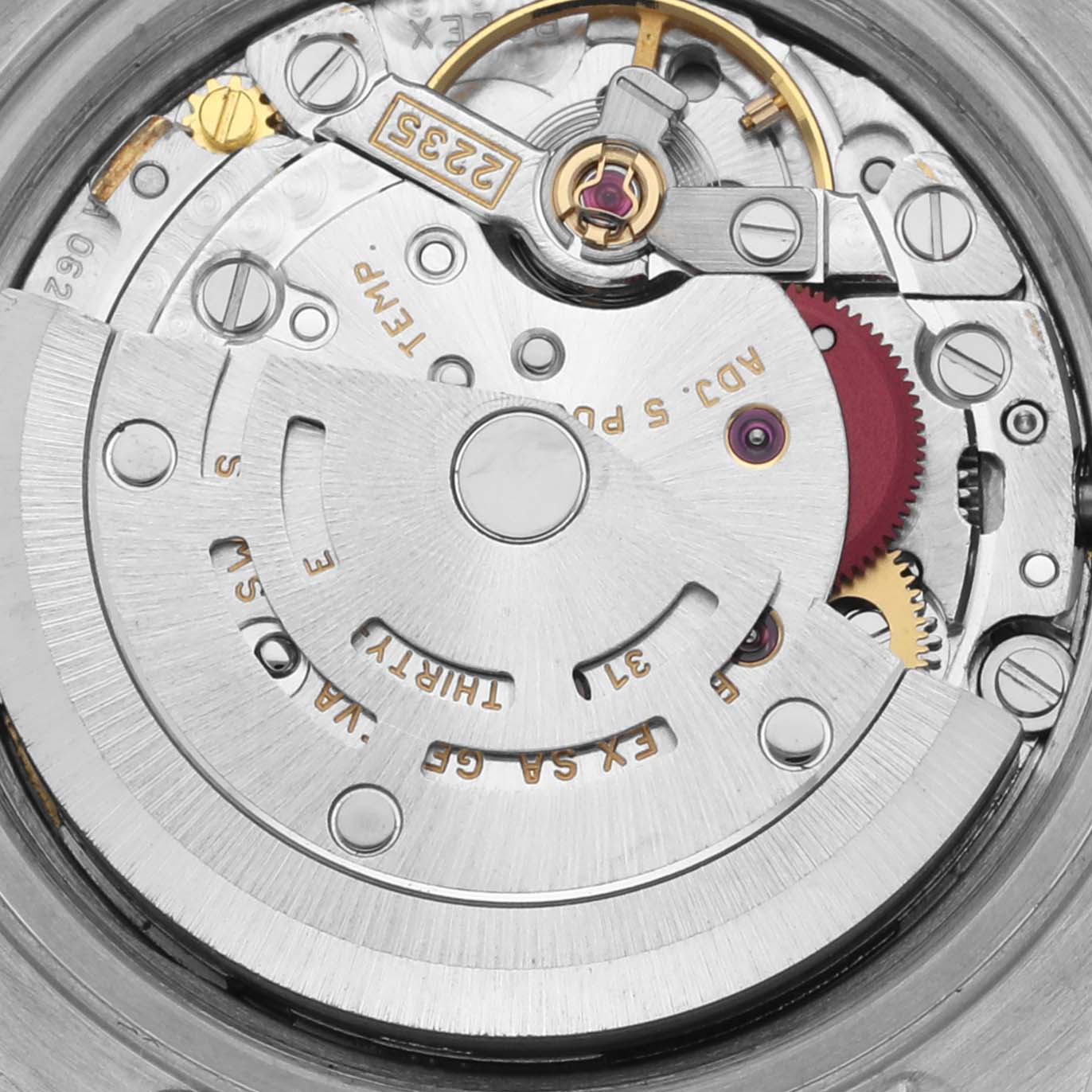 The image shows the intricate movement mechanism of a Rolex Datejust 79174 Women's Stainless Steel Mother of Pearl Dial 79174 Women's Stainless Steel Mother of Pearl Dial watch from a top-down angle, revealing gears and components.