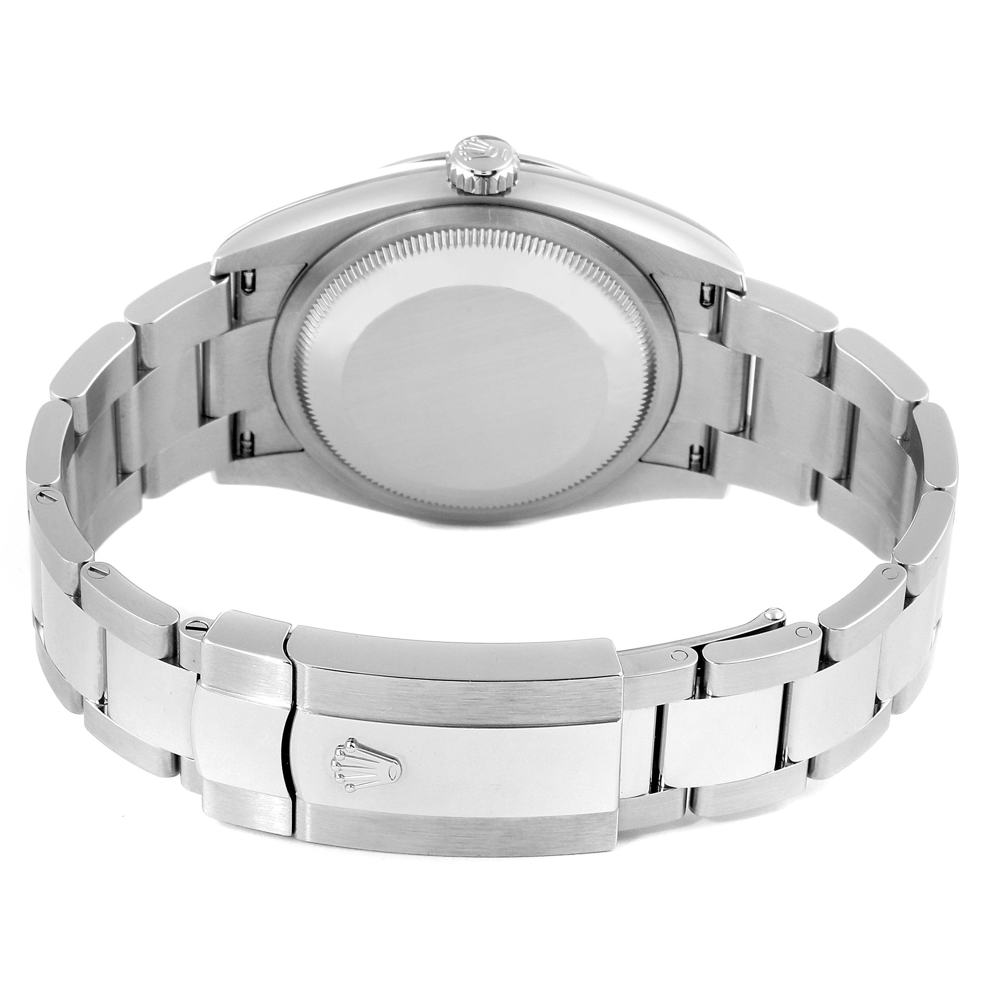 This image shows the back case, crown, and bracelet clasp of a Rolex Datejust 126200 Men's Stainless Steel Silver Dial 126200 Men's Stainless Steel Silver Dial watch from a rear angle.