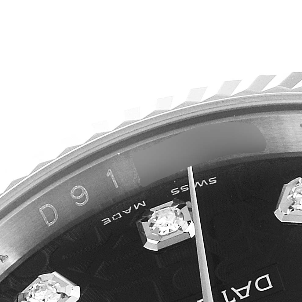 This image shows a close-up of the dial and bezel of a Rolex Datejust 116139 Men's White Gold Black Dial 116139 Men's White Gold Black Dial watch.