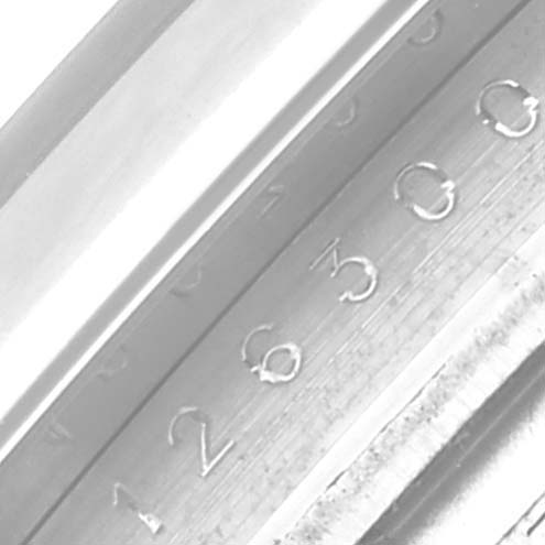 The image shows the side view of a Rolex Datejust 41 126300 Men's Stainless Steel Black Dial 126300 Men's Stainless Steel Black Dial model, focusing on the engraved serial or model number on the case.