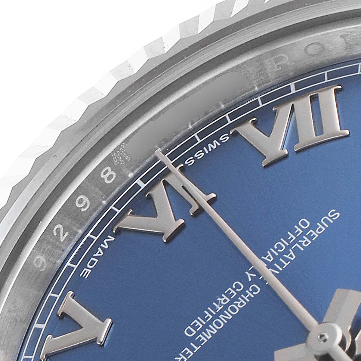 This image shows a close-up of the dial, bezel, and part of the face of a Rolex Datejust 41 116334 Men's Stainless Steel Blue Dial 116334 Men's Stainless Steel Blue Dial watch.