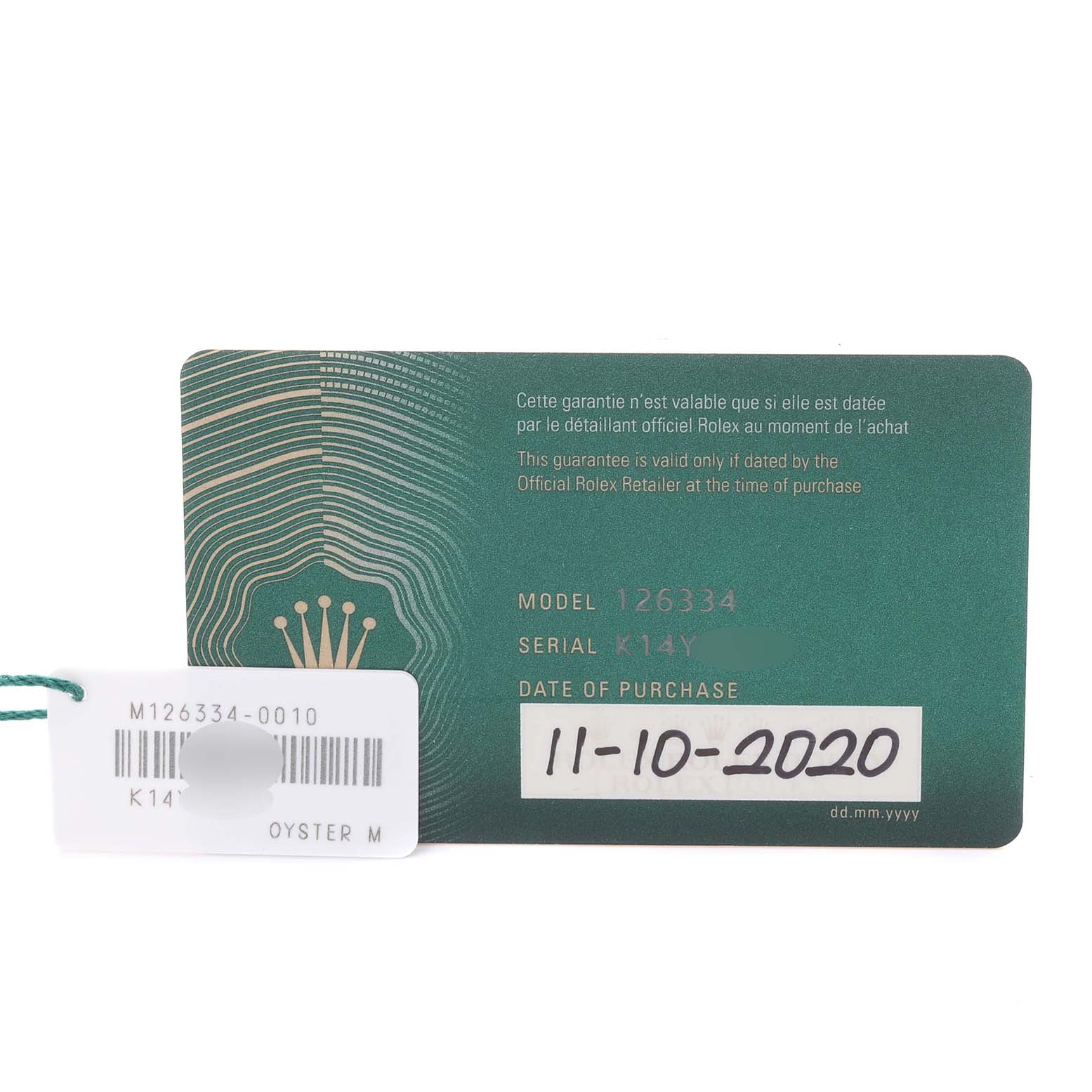 The image shows a Rolex Datejust 41 126334 Men
s Stainless Steel Silver Dial 126334 Men
s Stainless Steel Silver Dial model warranty card and a tag with model and serial information.