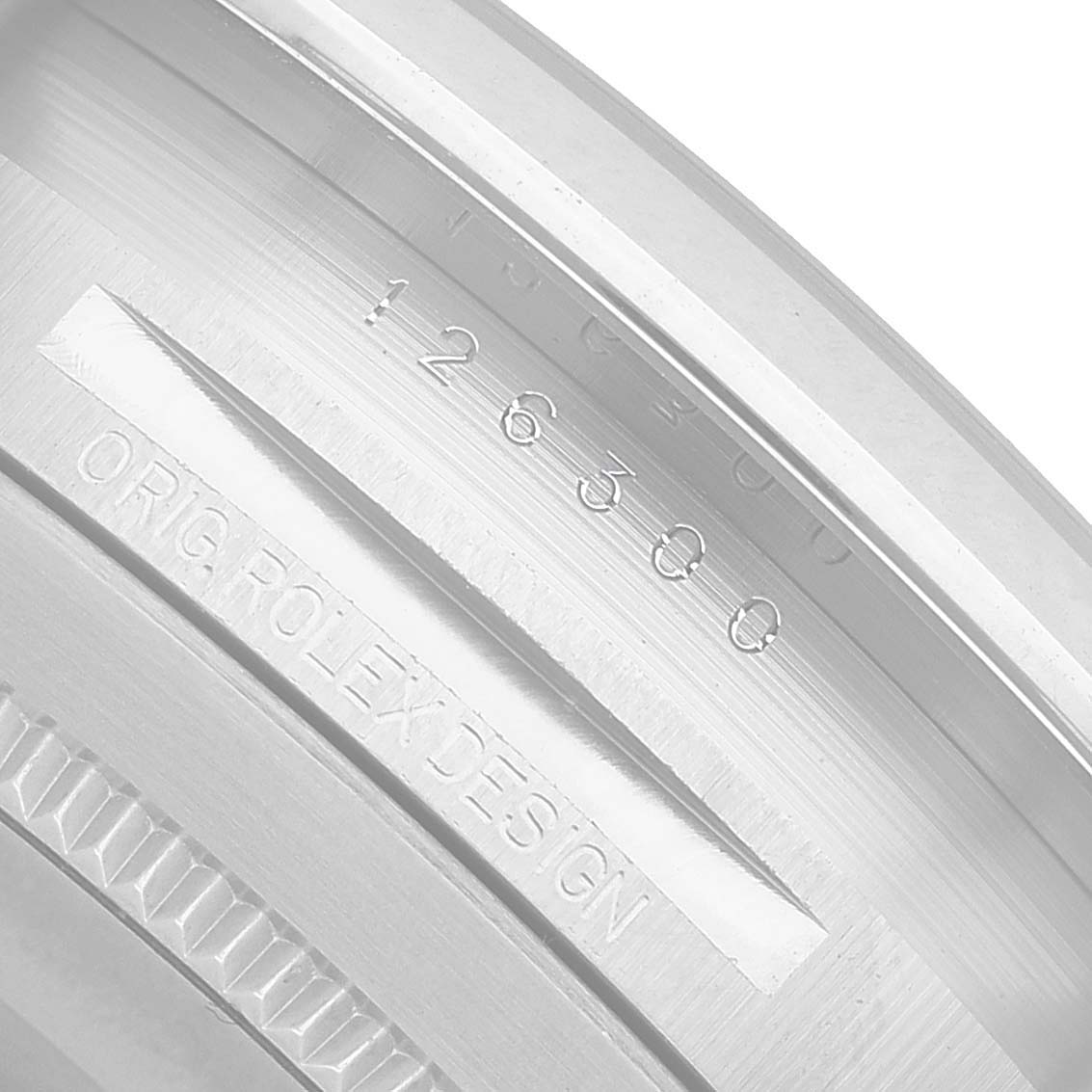 The image shows the side engraving of the Rolex Datejust 41 126300 Men's Stainless Steel Grey Dial model, displaying model and design numbers.
