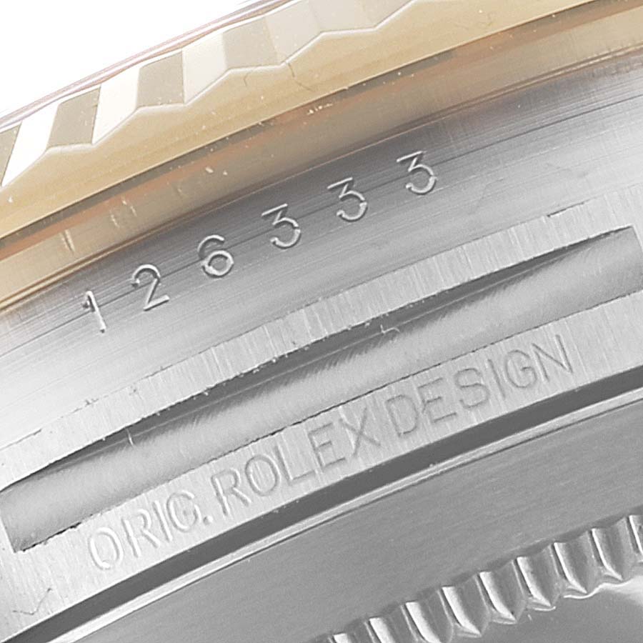 The image shows a close-up of the serial number and "ORIG. ROLEX DESIGN" engraving on the case side of a Rolex Datejust 41 126333 Men's Steel and Gold (two tone) Black Dial 126333 Men's Steel and Gold (two tone) Black Dial model watch.