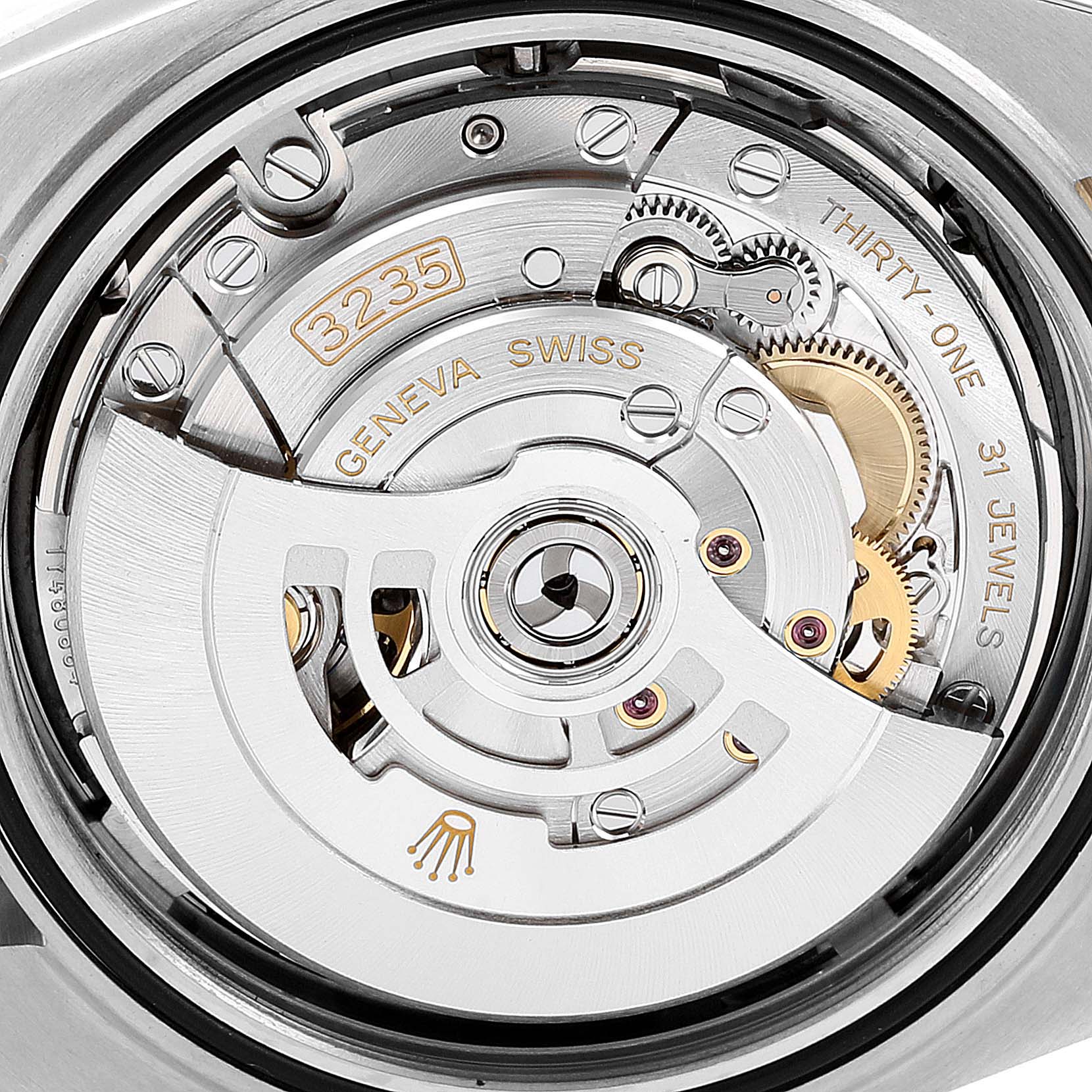 The image shows the inner movement of the Rolex Datejust 41 126333 Men's Steel and Gold (two tone) Black Dial 126333 Men's Steel and Gold (two tone) Black Dial watch, specifically the 3235 caliber with intricate gears and jewels.