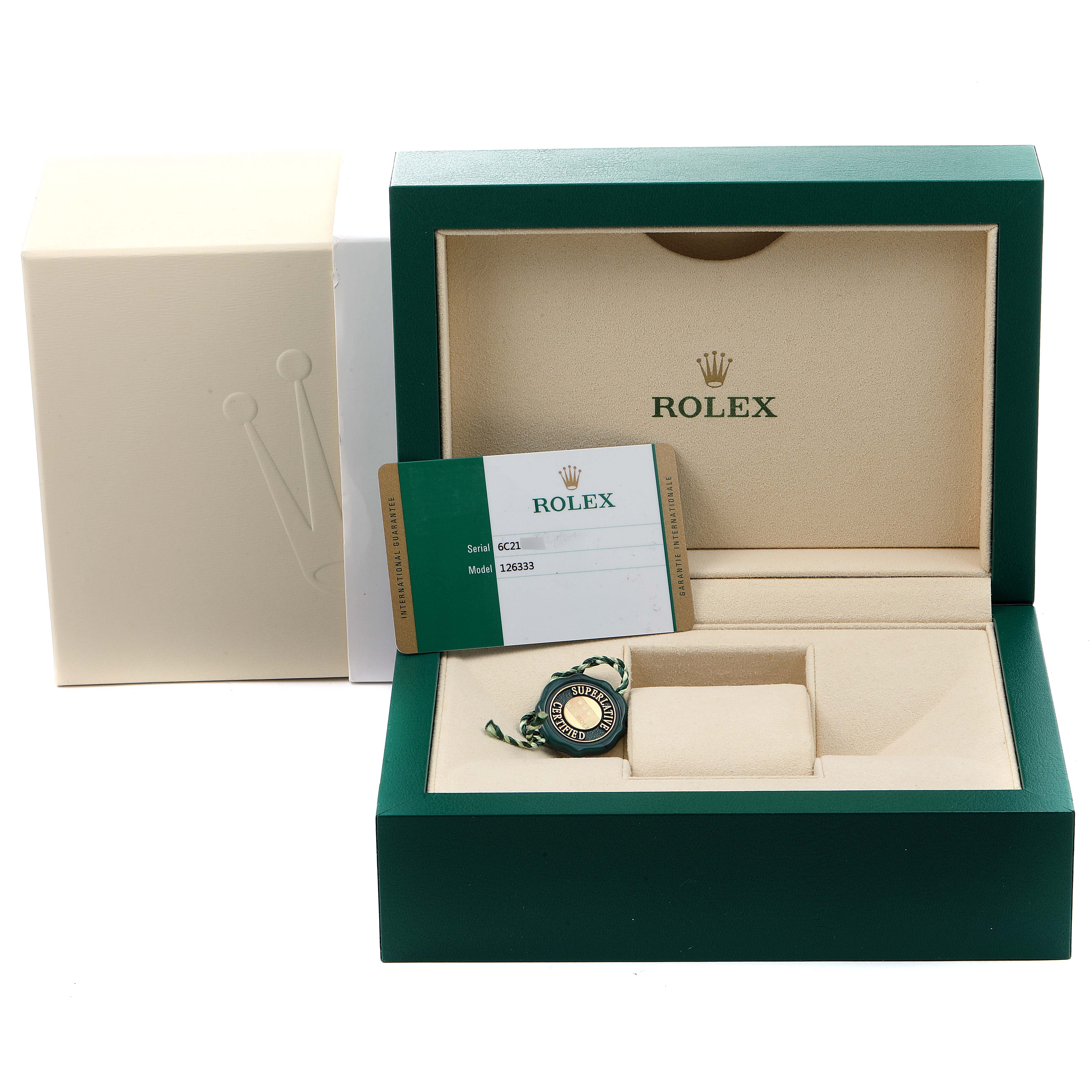 This image shows the packaging and accessories, including the warranty card, of a Rolex Datejust 41 126333 Men's Steel and Gold (two tone) Black Dial 126333 Men's Steel and Gold (two tone) Black Dial model.