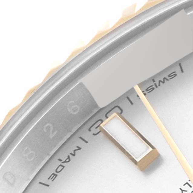 The image shows a close-up of the bezel, portion of the dial, and hour marker of the Rolex Datejust 41 126333 Men's Steel and Gold (two tone) Silver Dial 126333 Men's Steel and Gold (two tone) Silver Dial.