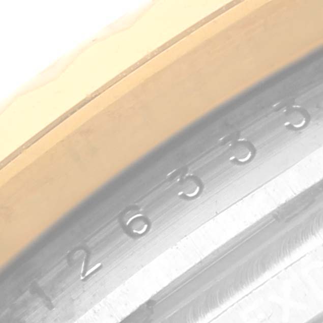 This image shows a close-up view of the bezel and a portion of the dial of a Rolex Datejust 41 126333 Men's Steel and Gold (two tone) Silver Dial 126333 Men's Steel and Gold (two tone) Silver Dial watch.
