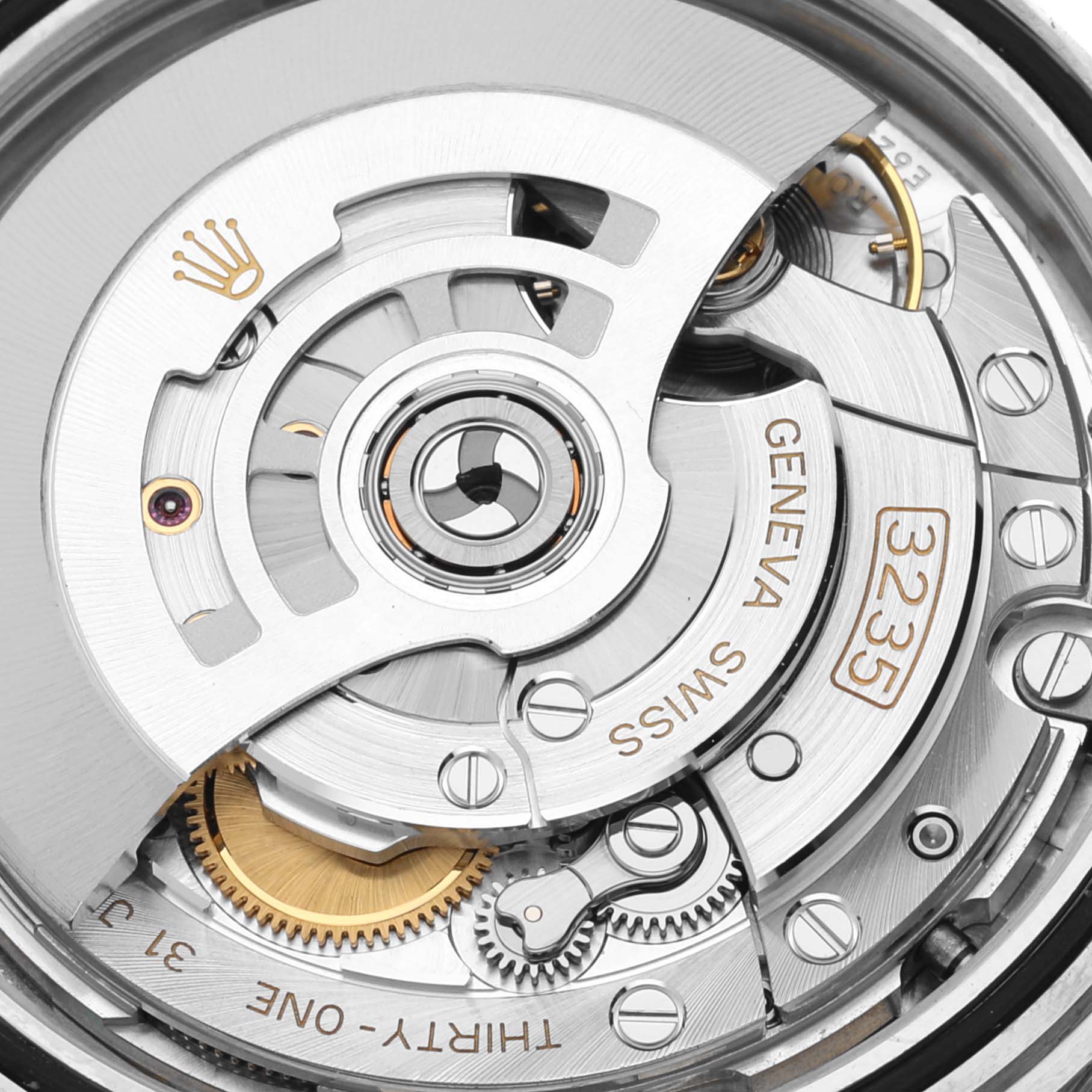 The image shows a close-up angle of the movement inside a Rolex Datejust 41 126333 Men's Steel and Gold (two tone) Silver Dial 126333 Men's Steel and Gold (two tone) Silver Dial model, highlighting its intricate internal mechanism and components.
