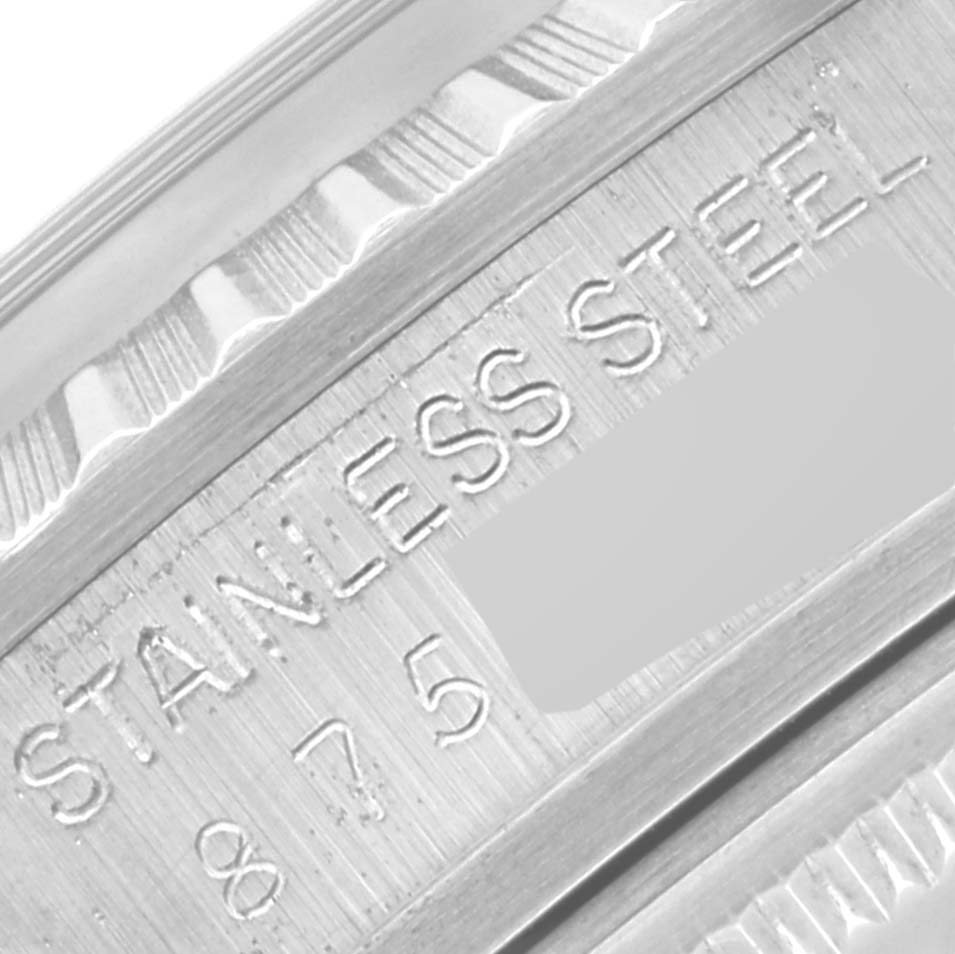 The image shows a close-up view of the side of a Rolex Vintage Collection 16030 Men's Stainless Steel Black Dial 16030 Men's Stainless Steel Black Dial watch, highlighting its stainless steel material and part of its serial number.