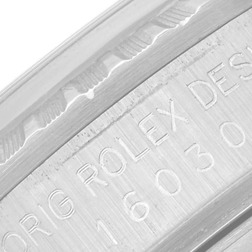 The image shows a close-up of the engraved case side of the Rolex Vintage Collection 16030 Men's Stainless Steel Black Dial 16030 Men's Stainless Steel Black Dial model.