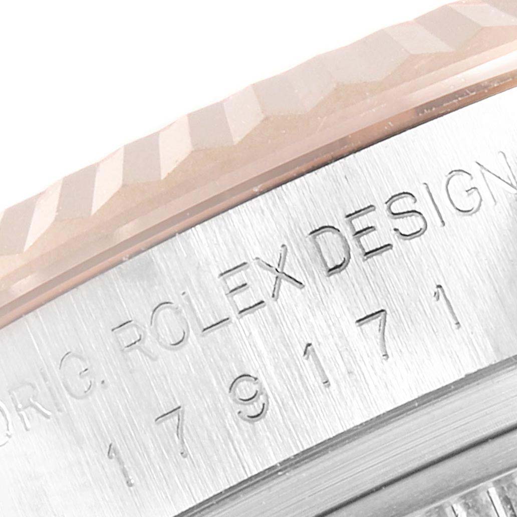 This image shows a close-up side view of the bezel and case of a Rolex Datejust 179171 Women's Steel and Gold (two tone) Mother of Pearl Dial 179171 Women's Steel and Gold (two tone) Mother of Pearl Dial watch, featuring the model number and "Rolex Design" engraving.