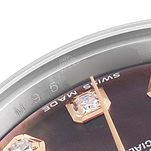 This close-up of a Rolex Datejust 179171 Women's Steel and Gold (two tone) Mother of Pearl Dial 179171 Women's Steel and Gold (two tone) Mother of Pearl Dial watch shows part of the dial, bezel, and diamond hour markers.