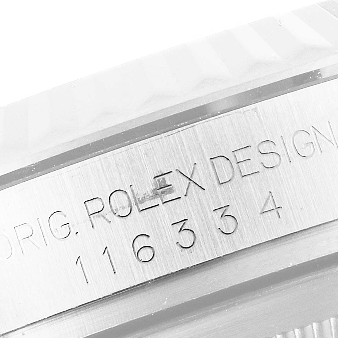 This image shows a close-up of the case side and bezel of a Rolex Datejust 41 116334 Men
s Stainless Steel Silver Dial 116334 Men
s Stainless Steel Silver Dial, featuring engraved text and model number.