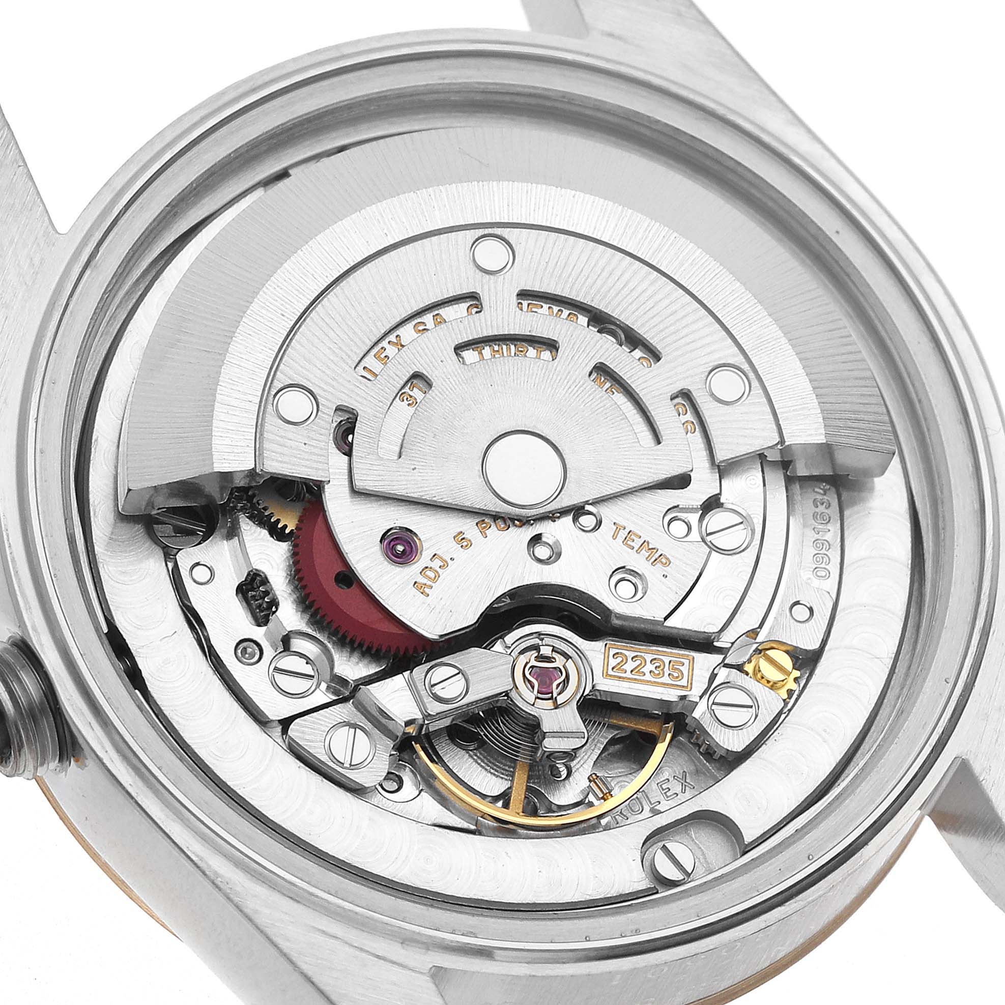 The image shows the movement of a Rolex Datejust 78273 Women's Steel and Gold (two tone) White Dial watch from the rear, highlighting the rotor and mechanical components.